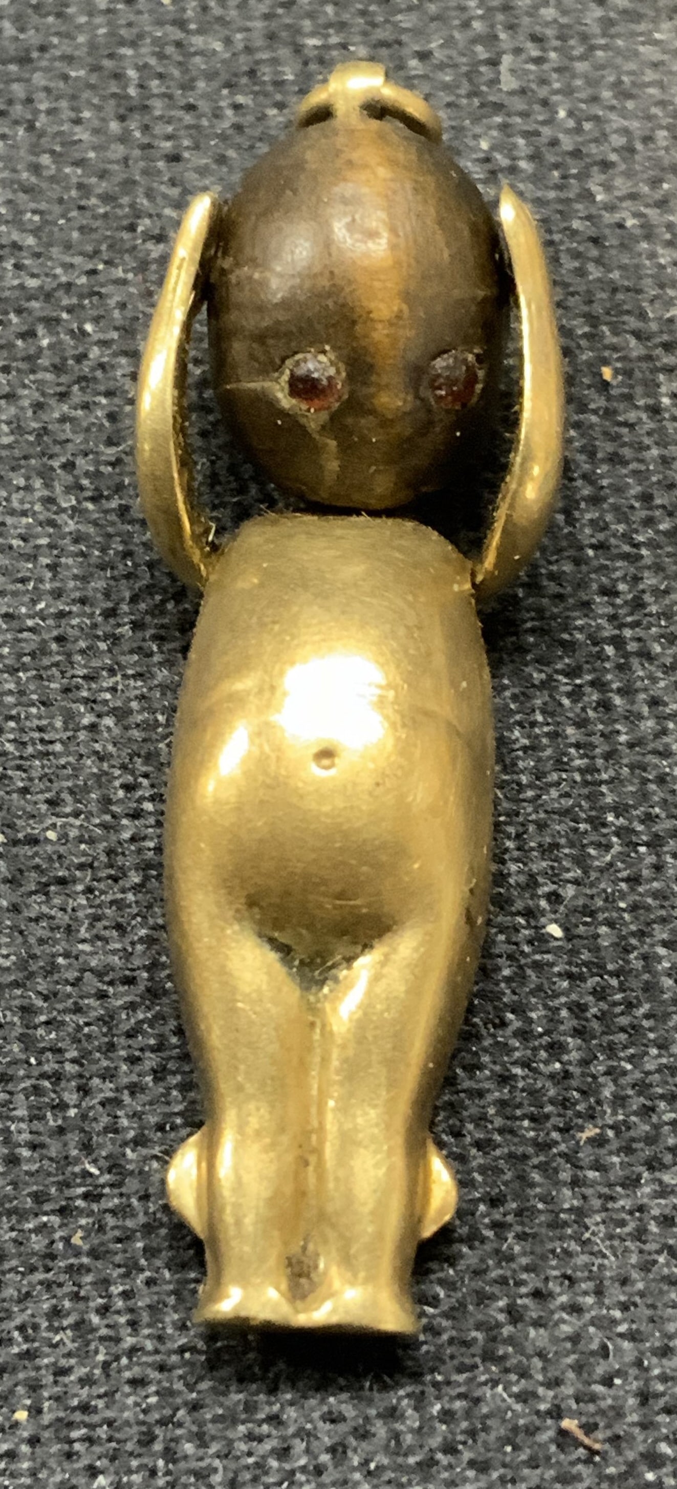 Vintage Gold Tone Baby Figural Pendant: Vintage gold tone baby figural pendant. Numbered to underside. Measures approx. 1.25 inches long. Some surface wear including scratching observed. Estate jewelry, costume jewelry, cocktail jewelry, fa