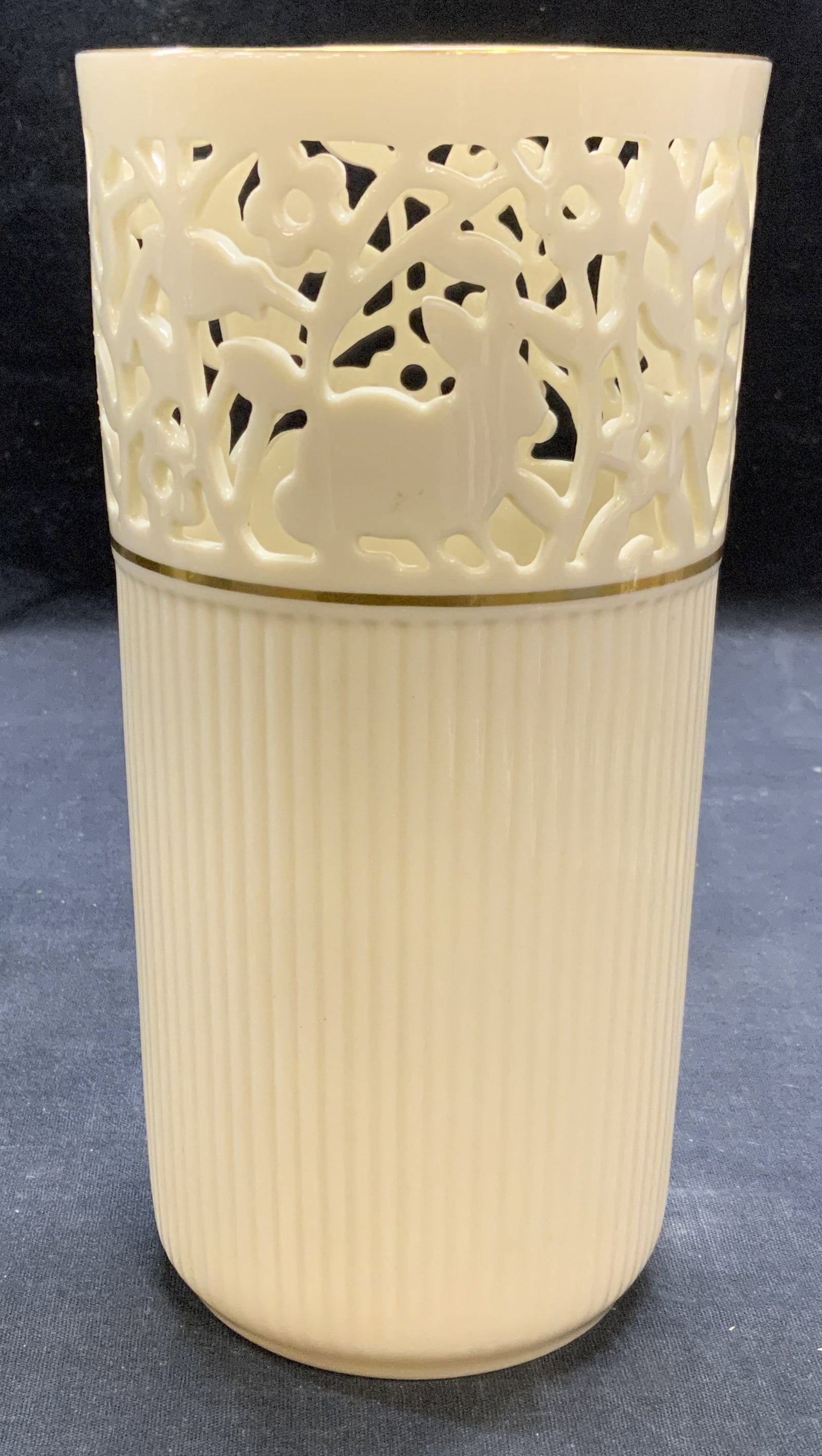 Lenox Gilt Porcelain Animal Vase: Lenox cream toned porcelain vase with gilt decoration and pierced animal motif. Trademarked to underside. Measures approx. 4 x 8 inches. Some surface wear including scratching observed. Lenox, Lenox v
