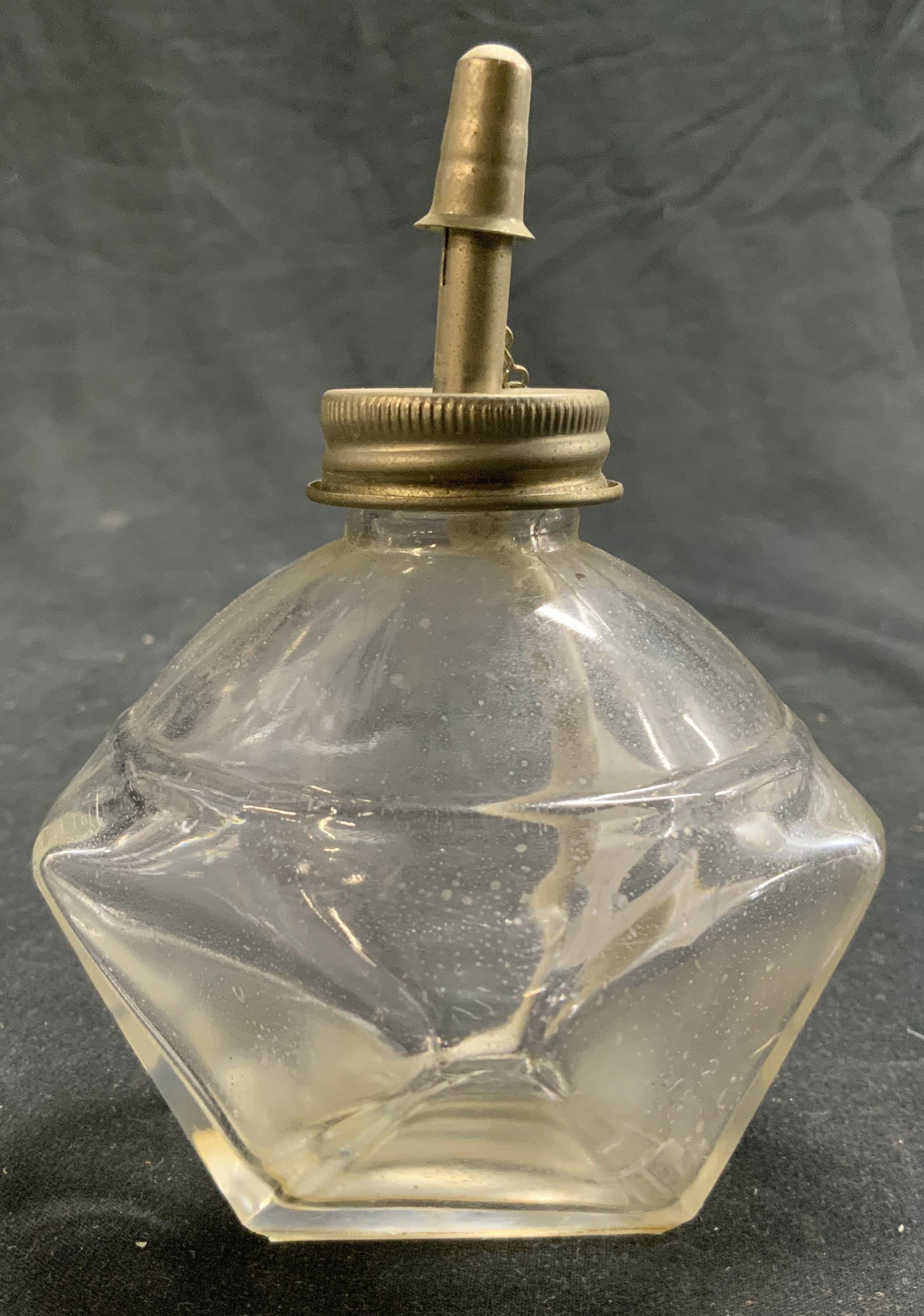 HR Japan Vntg Faceted Glass Alcohol Lamp Burner: Underside reads HR JAPAN. Alcohol lamp burner is vintage. Piece is glass with silver toned metal lid. Interior has white toned wick. Piece measures approximately 4.25 inches tall 2.5 inches wide 3.25 