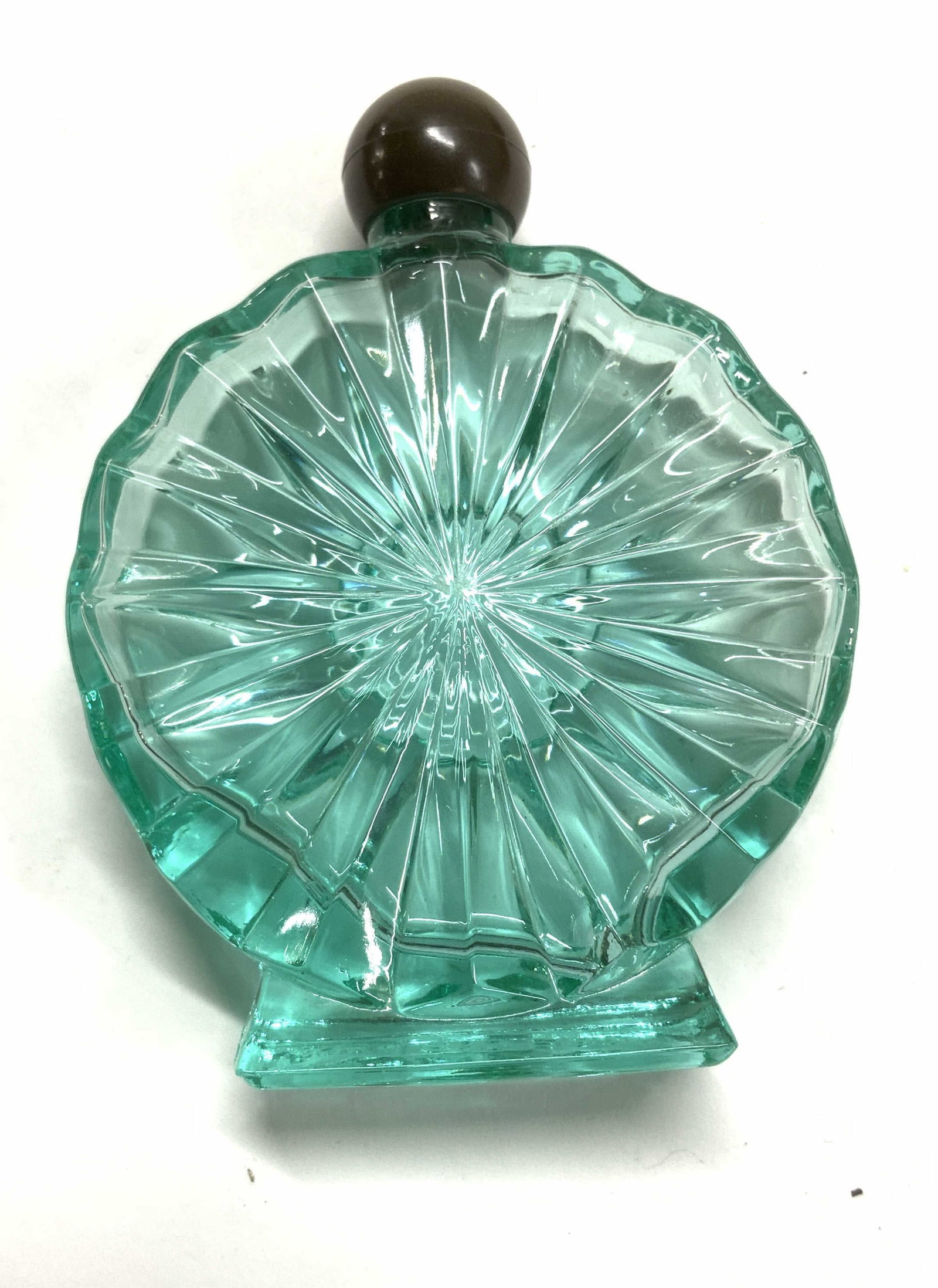 Aqua Tone Glass Perfume Bottle: Decorative glass perfume bottle with screw off cap. hallmarked Registered Number 810 980. Measures 3 7/8 in tall x 2.75 in. Wide. Embossed triangular and linear pattern radiating from the center. Deco