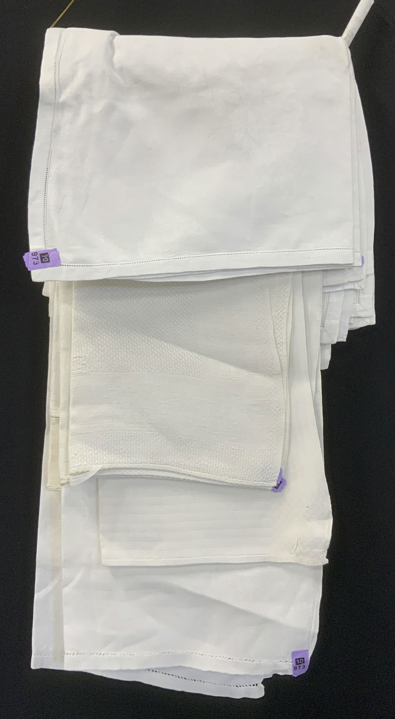 Group 12 Pressed White Table Linens: Table runner and dinner napkins. All white pressed linens., Linen and Damask. several Table runners/ tea towels , 46 x 19 in. and 55.5 & 22 in. are average dimensions . Mostly floral patterns. Set 6 l