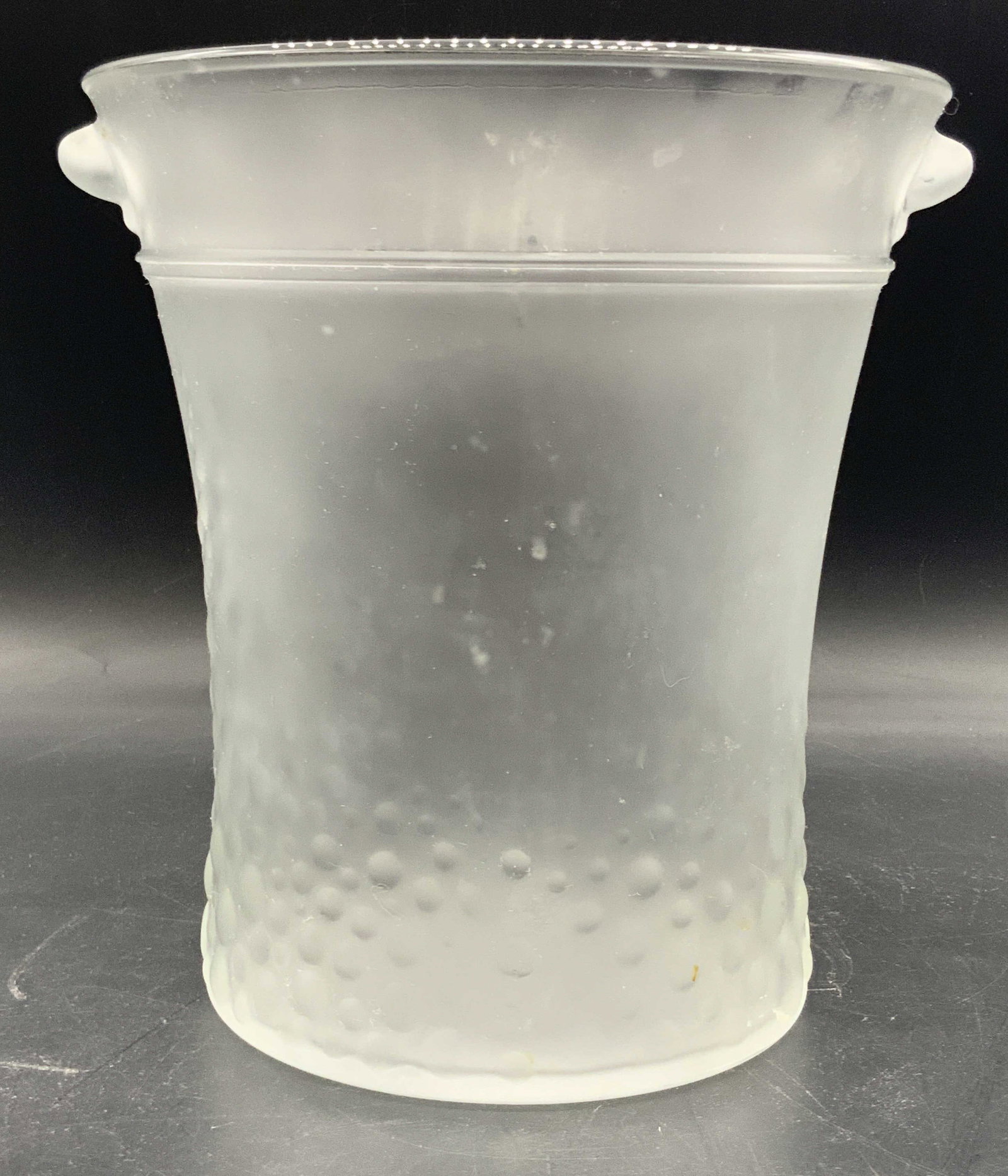 Vintage Italian Frosted Glass Ice Bucket: A vintage frosted glass ice bucket / champagne bucket. Raised bubble detail towards the base. Underside marked Italy. Glass seam to the sides. Thick walled and weighty. Measures approx. 8.75H x 8.25W 
