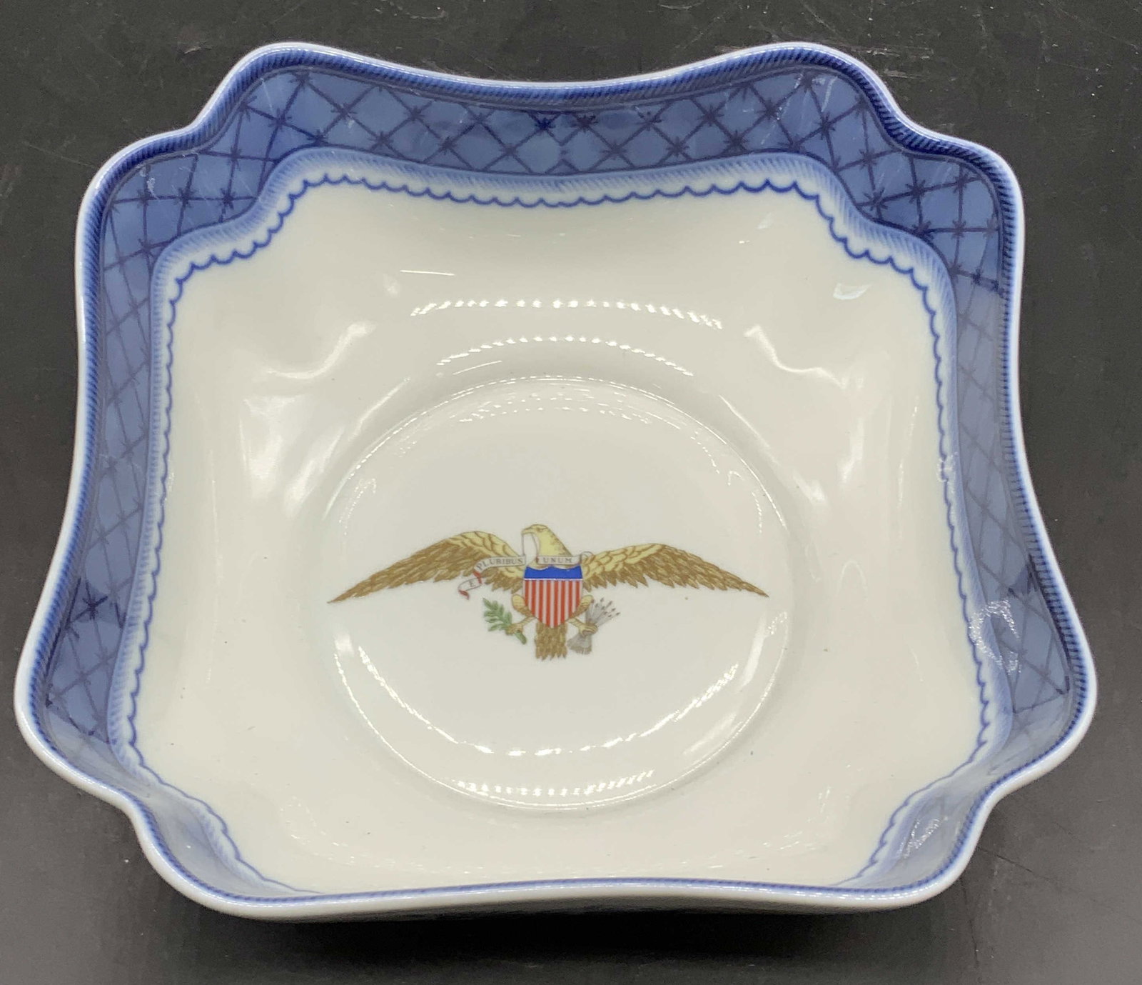 MOTTAHEDEH Diplomatic Eagle Square Porcelain Bowl: MOTTAHEDEH Diplomatic Eagle Blue & White Square Porcelain Bowl. Eagle motif to the center, reads E PLURIBUS UNUM. Measures approx. 2.5H x 6.75W in. Underside marked ESPECIALLY DESIGNED FOR THE DIPLOMA