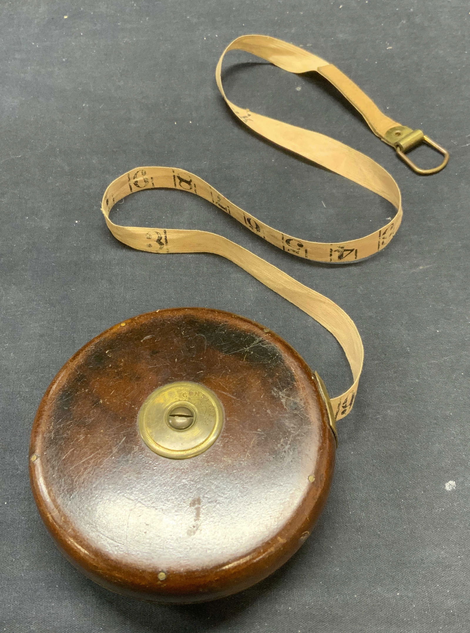 1920s Antq Constantia Chesterman 50Ft Tape Measure: 1920s Constantia by Chesterman Sheffield, England 50 foot tape measure. Vintage, possibly antique. Trademarked in case and tape. Wood case with brass hardware and fabric tape reel. Possibly hand print