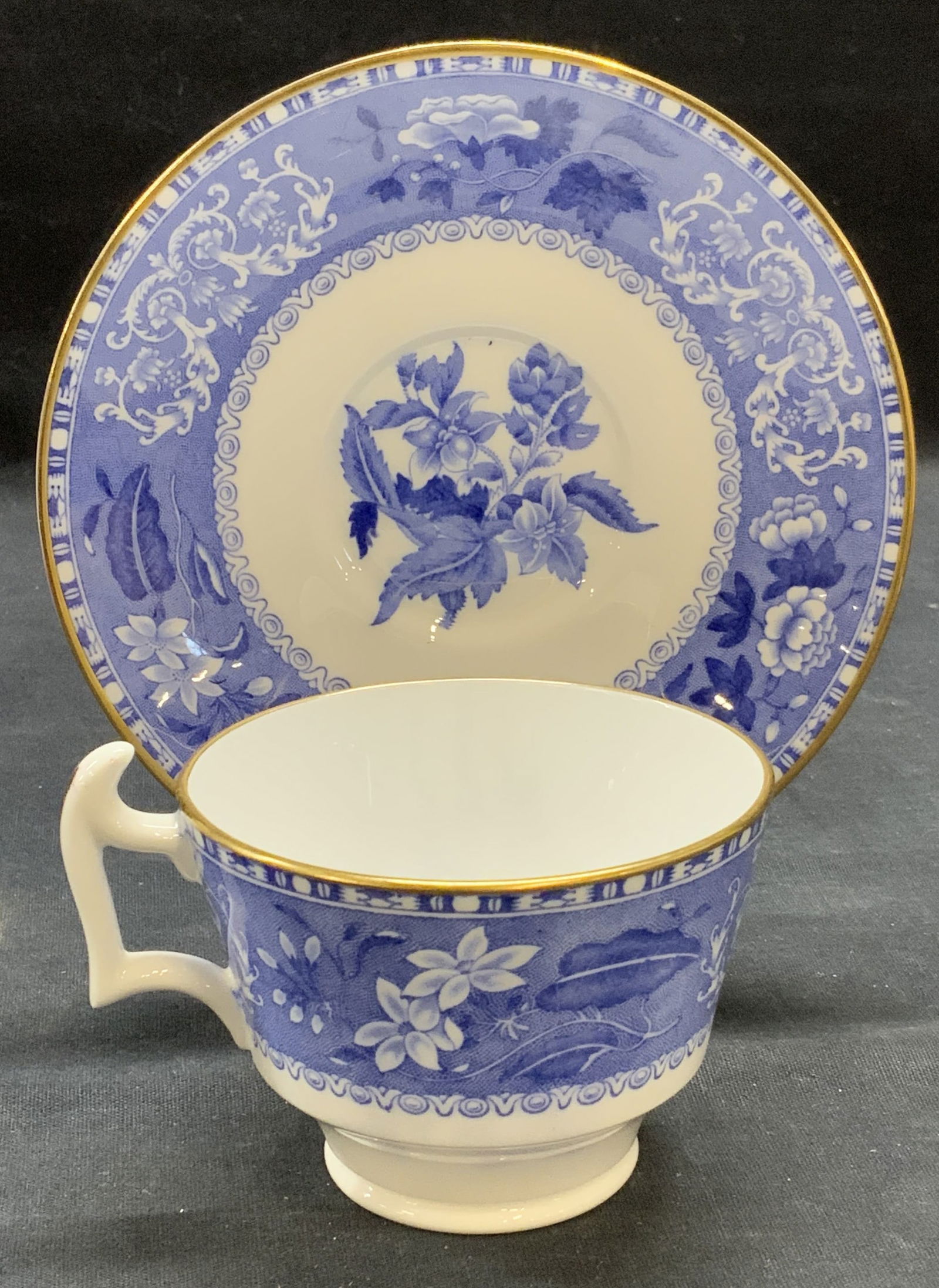 Vintage Spode Camilla China Teacup &Saucer England: Vintage Spode bone china teacup and saucer. Camilla floral pattern in blue and white with gilt decoration. Trademarked to undersides. Made in England. Saucer measures approx. 5.75 inches diameter. Tea