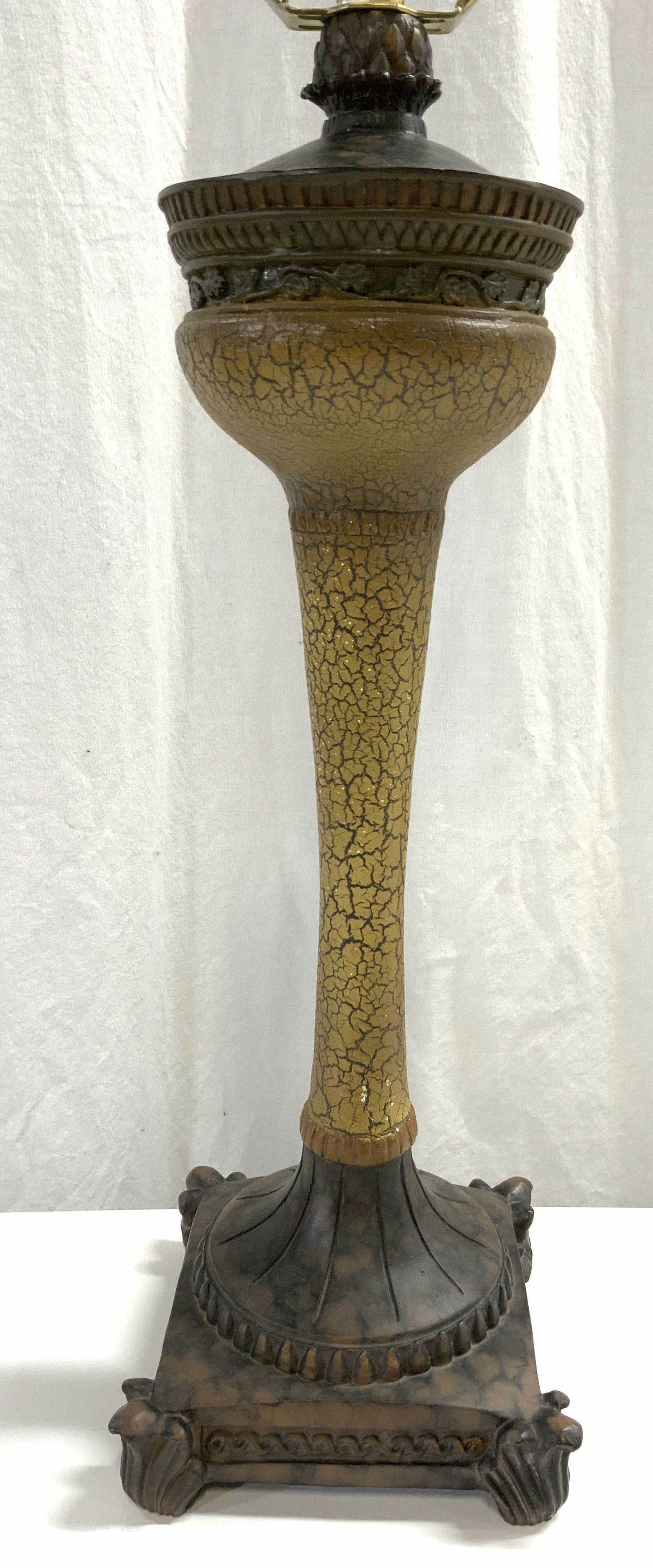 Wood & Resinous Vintage Victorian Table Lamp: Lamp appears to be wood and resin. Lamp includes harp and finial. Piece has 4 leaf form feet. Tapered area has beige toned crackled detail. Finial resembles artichoke shape. Lamp measures approx 27 in