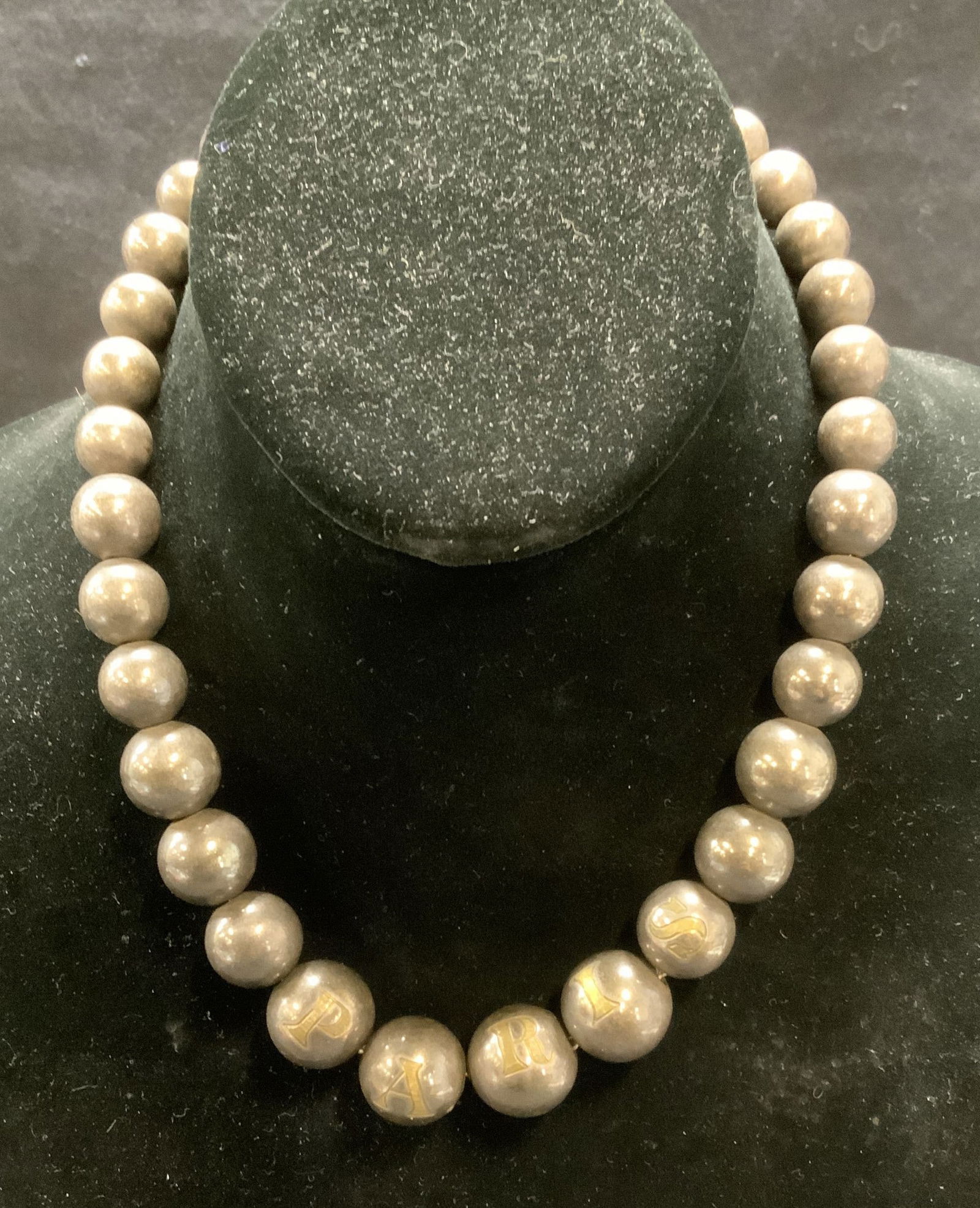 Sterling Silver Paris Beaded Necklace: Sterling silver graduated beaded necklace with etched letter beads that read PARIS. Drop length approx. 7 inches. Total weight 3.13 ozt. Beads test for sterling using PuriTEST kit. Patina and some scr