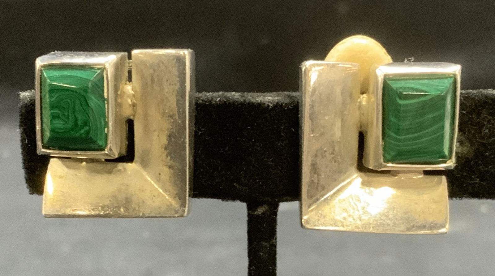 Vintage Sterling Silver Malachite Style Earrings: Vintage sterling silver malachite style glass earrings. Marked 925. Clip on backing. Measure approx. 7/8 x .75 inches. Total weight 21.7 grams. Some surface wear including scratching observed. Estate