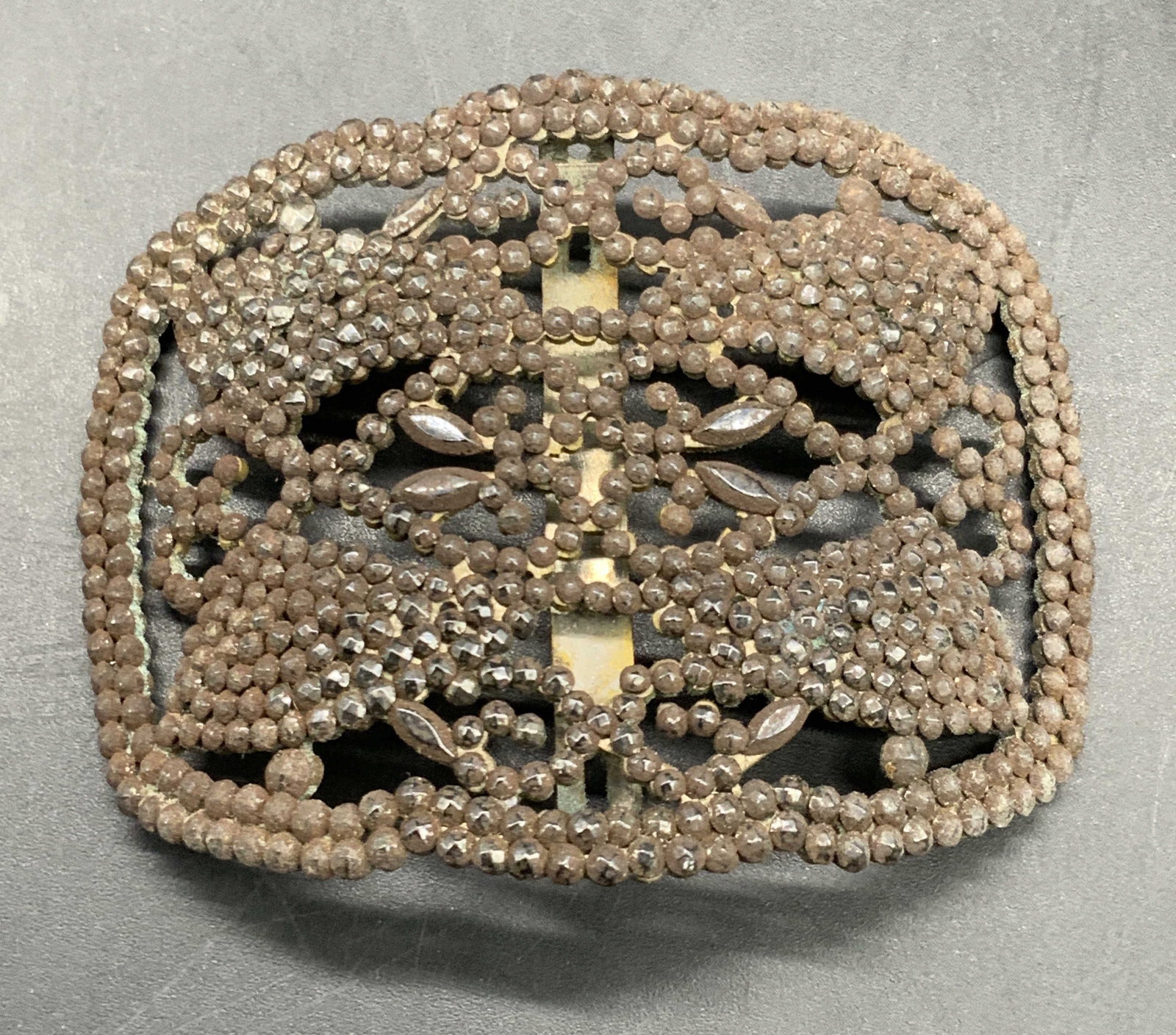 MB Vintage Art Deco Shoe Clip/Belt Buckle, France: A vintage art deco style shoe clip / belt buckle crafted from metal. Studded with faceted beads. Reverse marked MB, MADE IN FRANCE. Measures approx. 2.5W x 2L in. Some surface wear and discoloration p