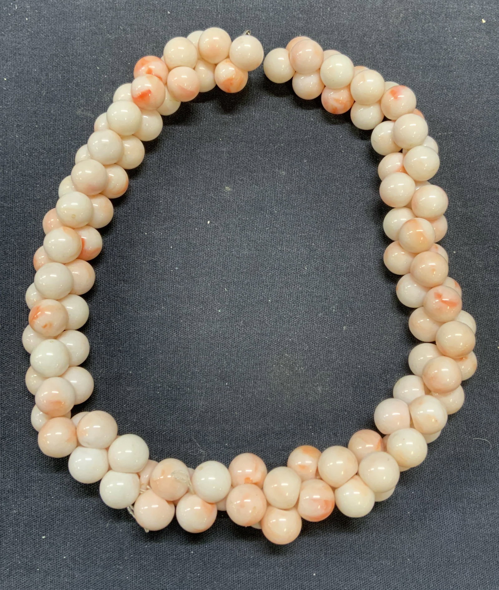 Angel Skin Coral Style Choker Necklace: Faux angel skin coral beaded choker necklace. Drop length approx. 6.25 inches. Some scratching observed. Estate jewelry, costume jewelry, cocktail jewelry, fashion jewelry, accessories, fashion access