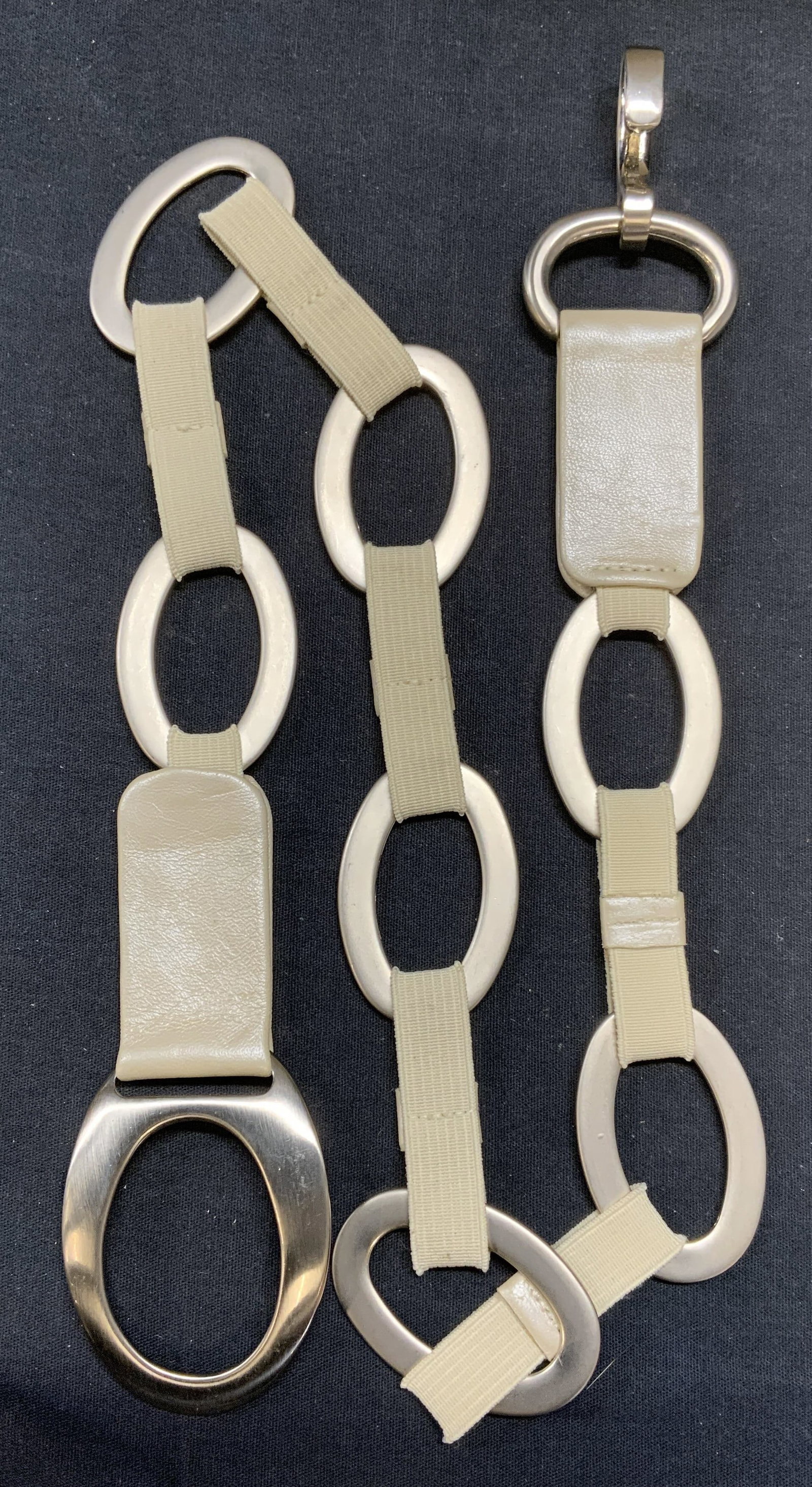 SUZI ROHER Style Silver Tone Beige Leather Belt: SUZI ROHER style silver tone disc and beige leather trim belt. Signed on leather illegibly. Measures approx. 33 inches long. Some wear to material consistent with exposure. Ladies belt, ladies accesso
