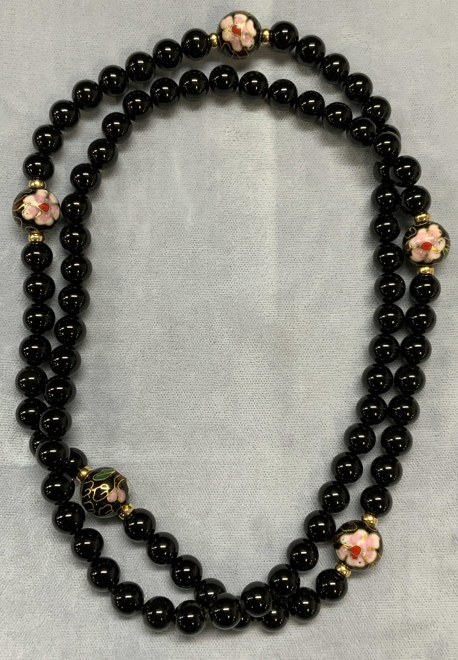 Black Stone & Cloisonne Beaded Necklace: Round black stone and black enameled cloisonne beaded necklace with floral motif. Drop length approx. 14 inches. Some surface wear including scratching observed. Estate jewelry, fine jewelry, cocktail
