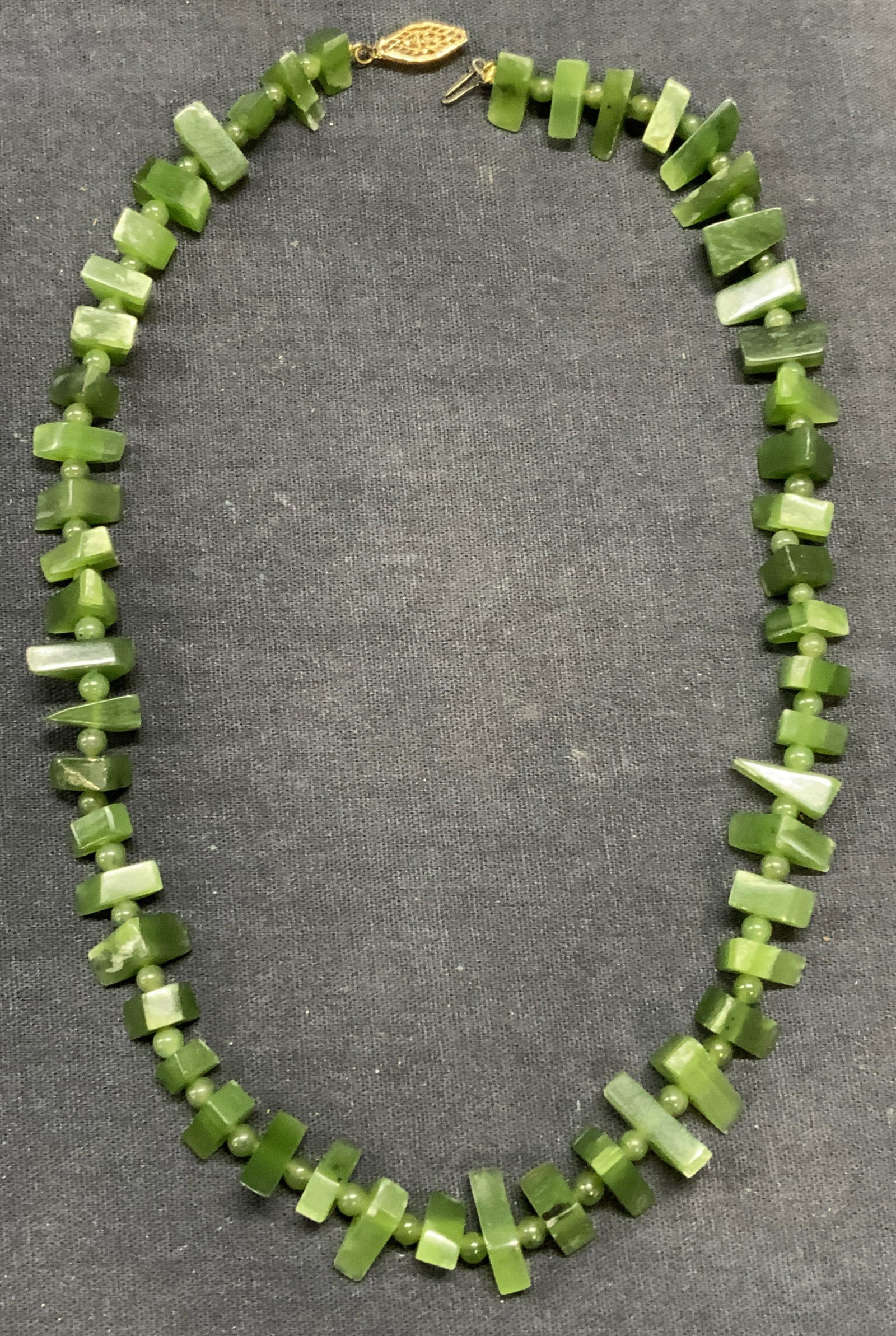 Green Gemstone Beaded Choker Necklace: Green gemstone beaded choker necklace. Sterling silver clasp, marked sterling. Drop length approx. 8 inches. Some surface wear including scratching observed. Estate jewelry, fine jewelry, cocktail jew