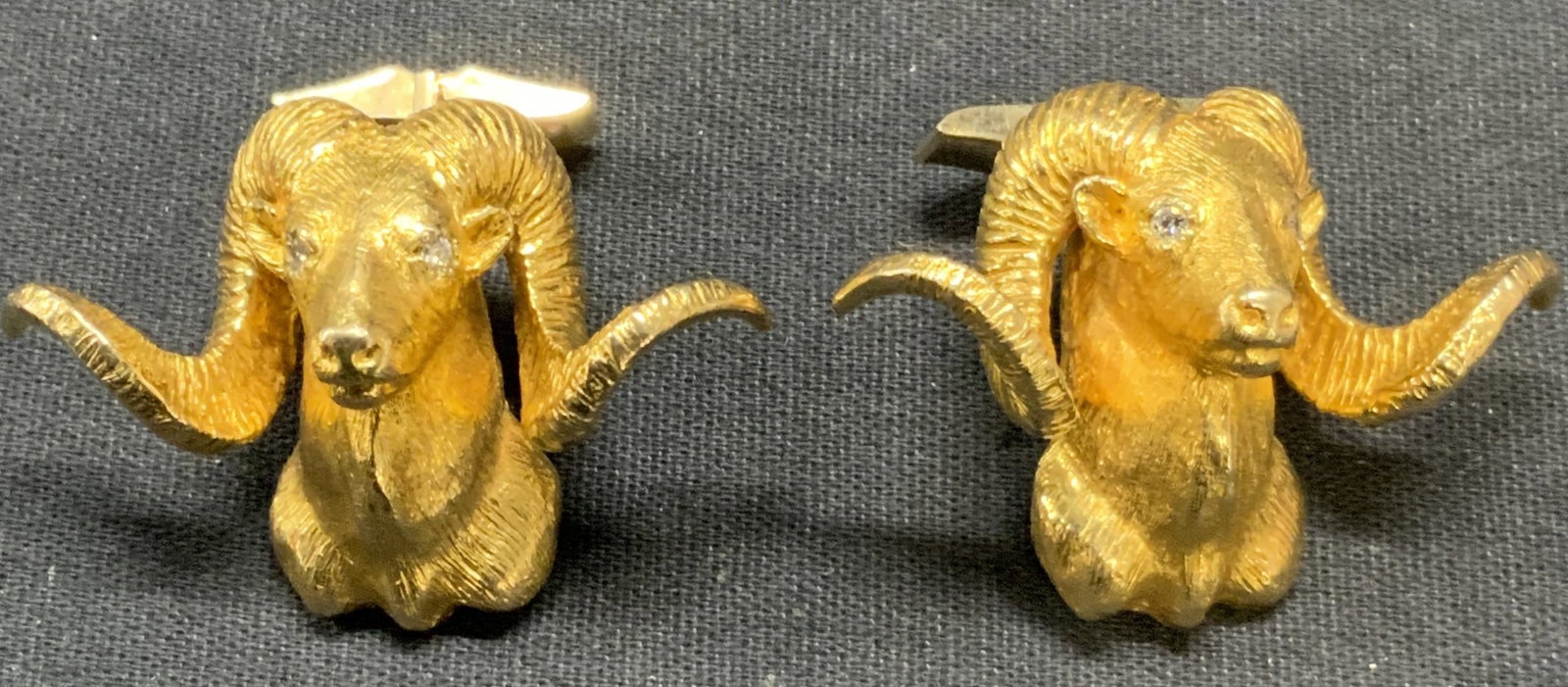 Vtg 10k Gold & Diamond Ram Head Cufflinks: Vintage 10k gold sculptural Ram head motif Cufflinks. Diamond accent eyes. 12k gold filled clasp. Marked 10k on head and 12k gf on clasp. Measure approx. 1.25 x 1.75 inches. Total weight 64.4 grams. P