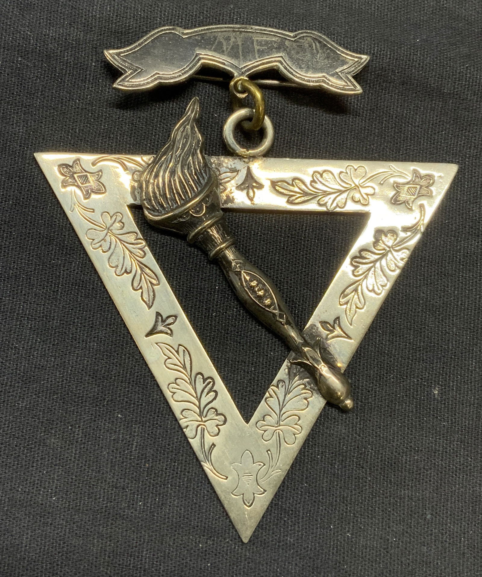 Antique 1874 Supreme Lodge Masonic Pin: Antique 1874 silver tone Supreme Lodge Masonic pin. Triangle shape with torch motif. Etched scroll border. Marked SS Davis, S. C., Supreme Lodge, copyright 1874 to underside. Measures approx. 3.5 x 3