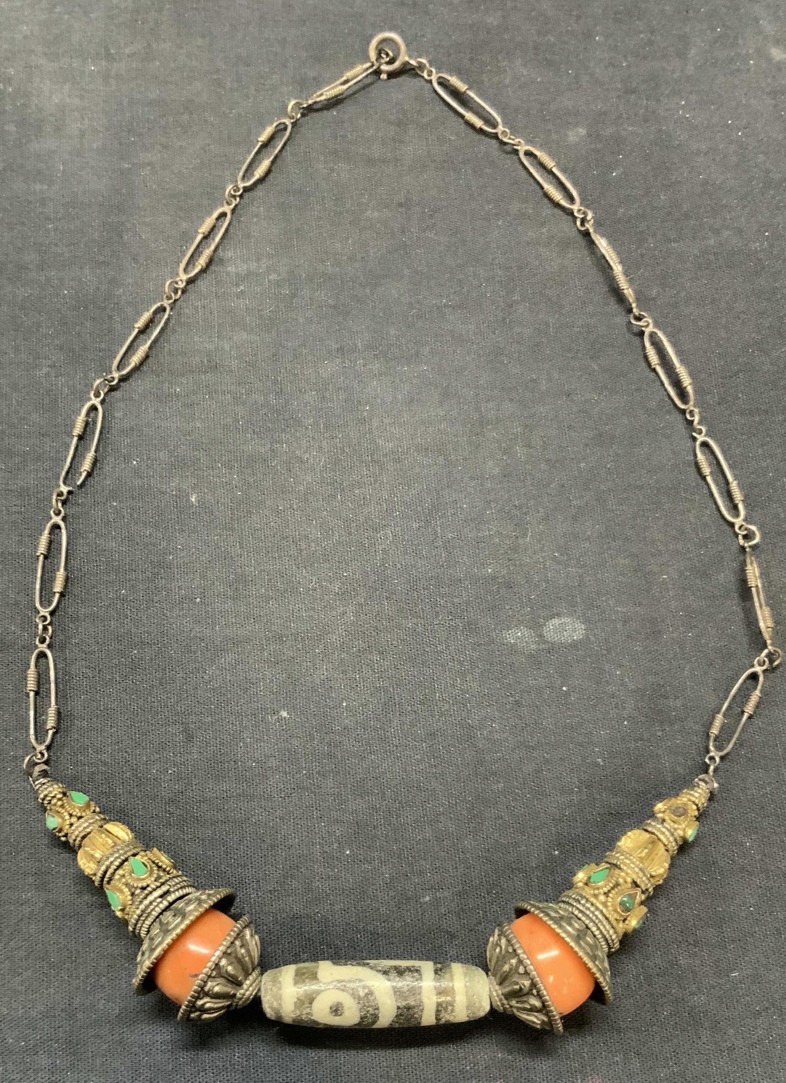 Vintage Sterling Silver Coral & Stone Necklace: Vintage sterling silver necklace with gold plated accent, green and grey stone, and coral beads. Marked sterling on clasp. Drop length approx. 9 inches. Total weight 61 grams. Some surface wear includ