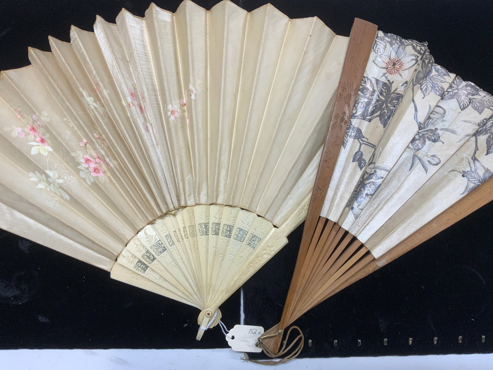 2 Antique Handmade & Painted Hand Fans, Silk: Asian Bamboo hand fan hand painted on heavy paper , carved bamboo guards. Large brass loop. Approx 13.5 in. Long. Evident wear to paper . Victorian carved and pierced bone fan with hand painted pink f