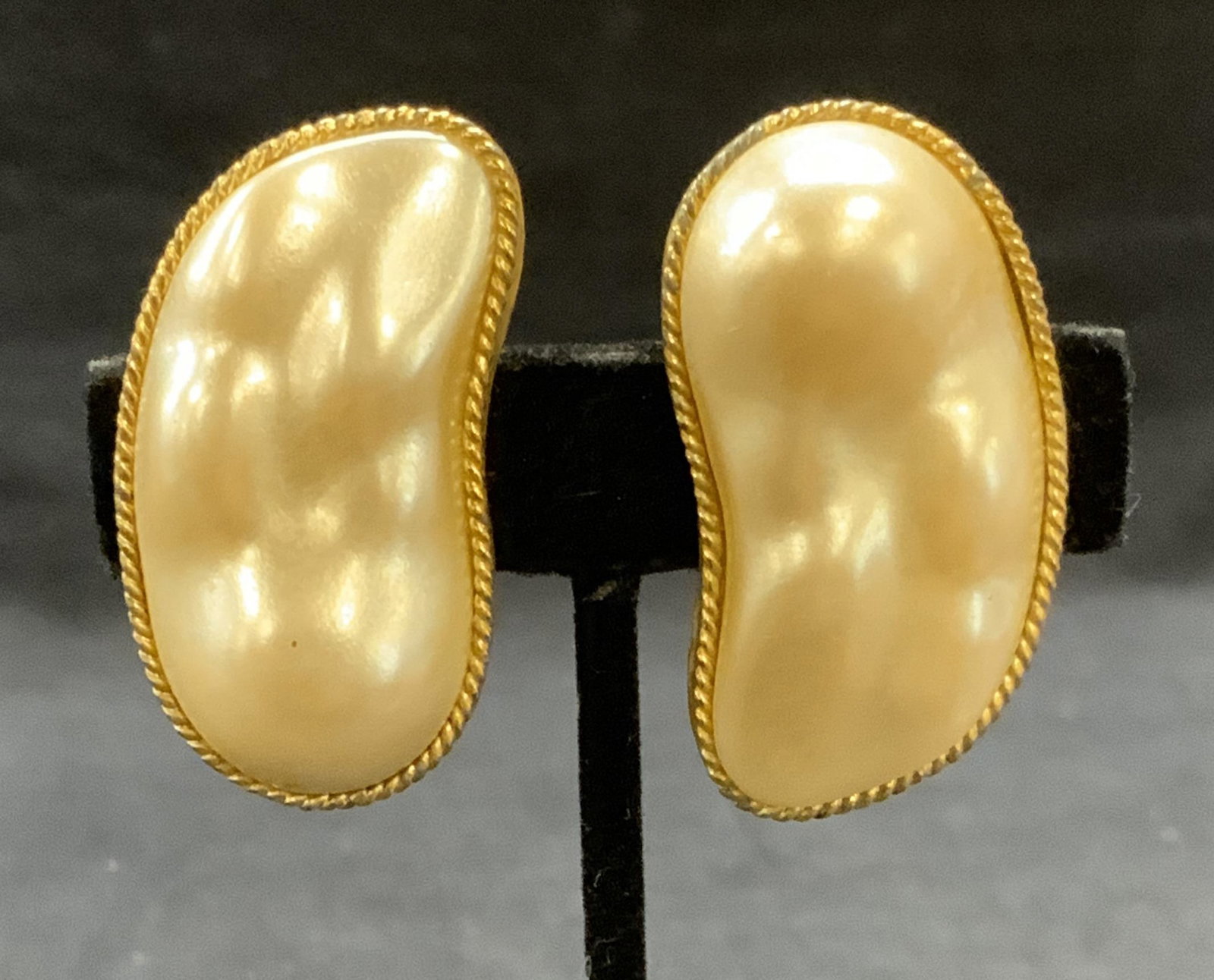 Vtg Kenneth Lane Gold Tn Faux Pearl Earrings: Vintage Kenneth Lane gold tone and faux pearl decorated earrings. Signed to underside. Clip on backing. Measure approx. 1.75 x 1 inches. Some surface wear including scratching observed. Estate jewelry