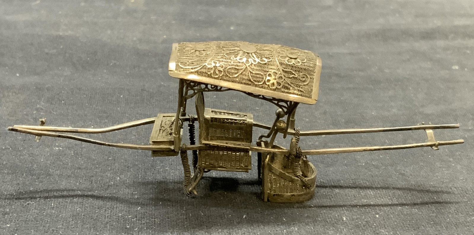 Vtg Hallmarked Sterling Silver Rickshaw Figural: Vintage hall marked sterling silver rickshaw figural. Filigree and floral decoration. Hallmarked illegibly to underside. Tests for sterling using PuriTEST kit. Measures approx. 4.25 x 1 x 1.5 inches. 