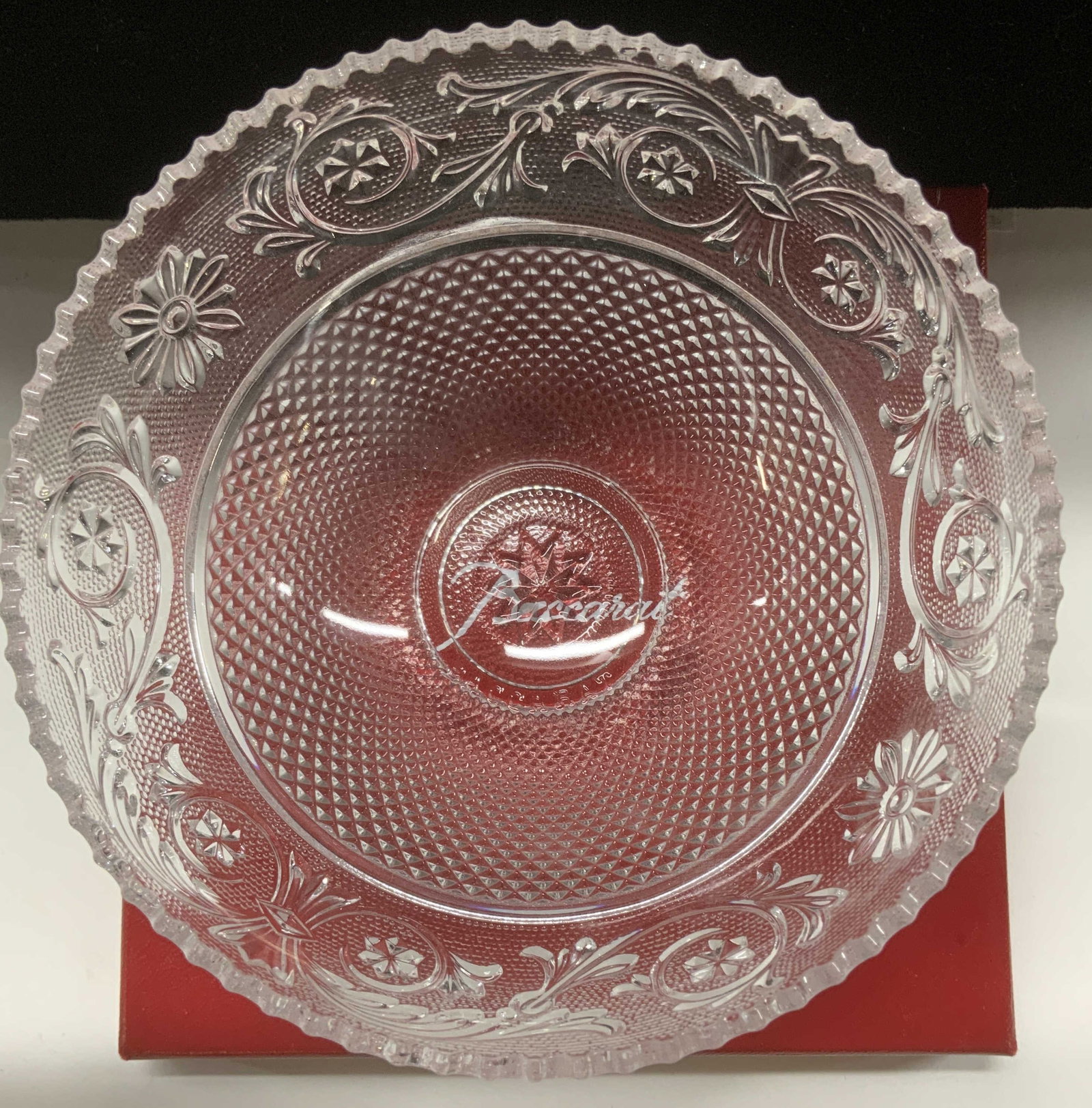 BACCARAT France Crystal Bowl, NIB: Decorative Baccarat sawtooth rim crystal bowl. Flower and acanthus leaf and scroll decor in relief. Bowl measures 4.5 in. Diameter, 2.25 in. Ht. New in Baccarat red box. Signed Baccarat., Crystal Bacc