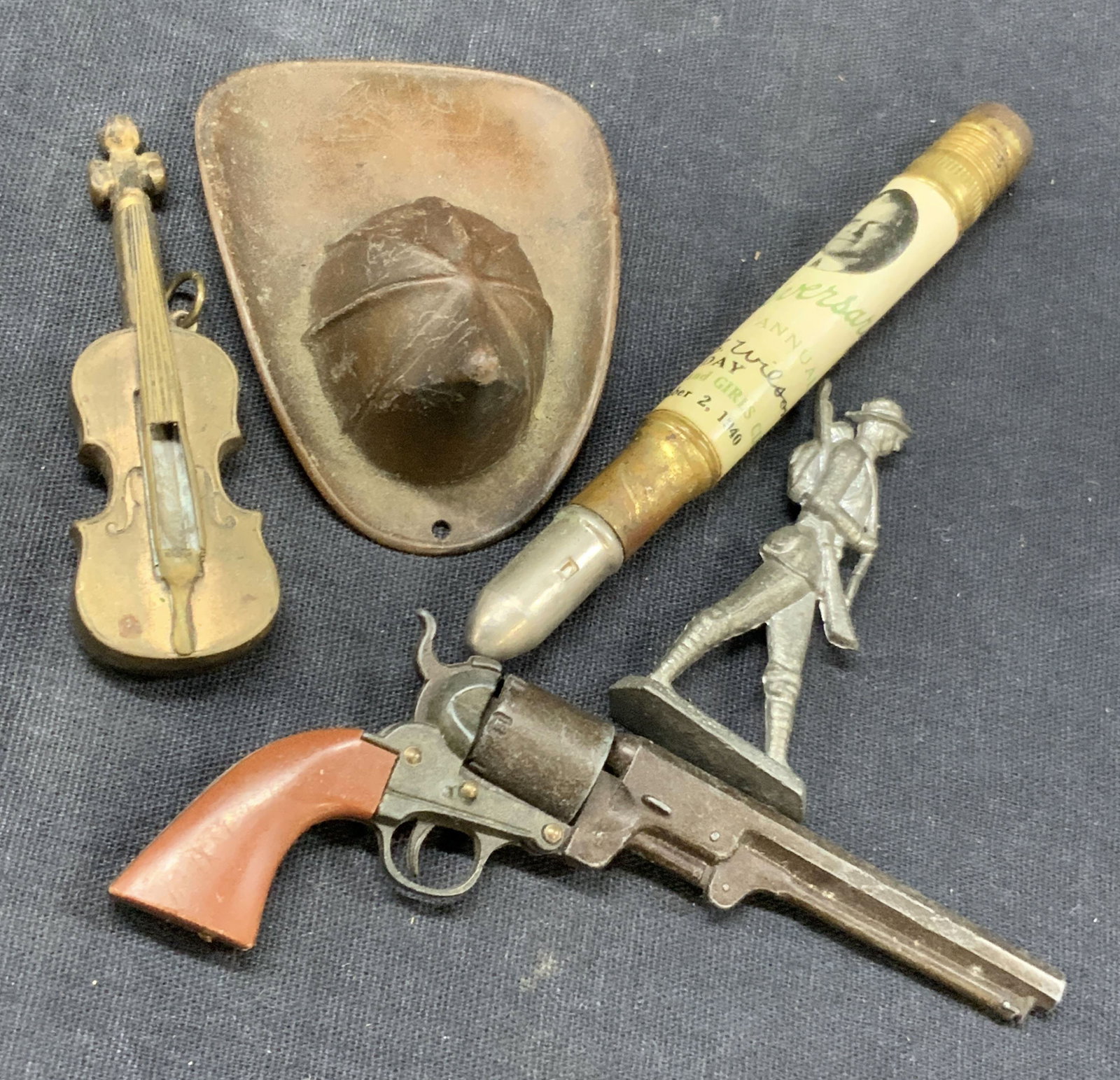 Lot 5 Vtg Brass & Metal Toys & Pendants: Lot of 5 vintage metal crafted accessories, 1 brass made violin pendant, 1copper crafted firefighter helmet at 2.75 inches long. 1 1940 boys and girls club pencil. 1 pewter made toy solider at 2 inche