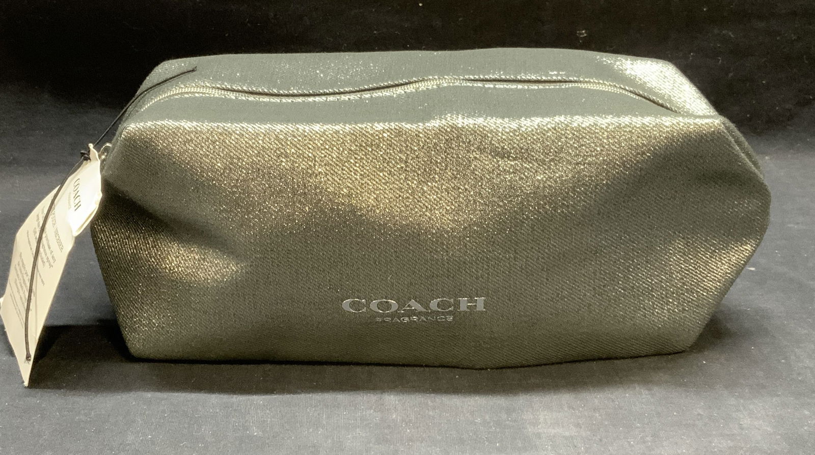 Coach Metallic Silver Tn Toiletry Pouch NWT: Coach metallic silver tone fabric toiletry pouch. New with tag. Signed to exterior. Measures approx. 9.5 x 4 x 4.25 inches. Some surface wear consistent with exposure. Coach, coach pouch, coach toilet