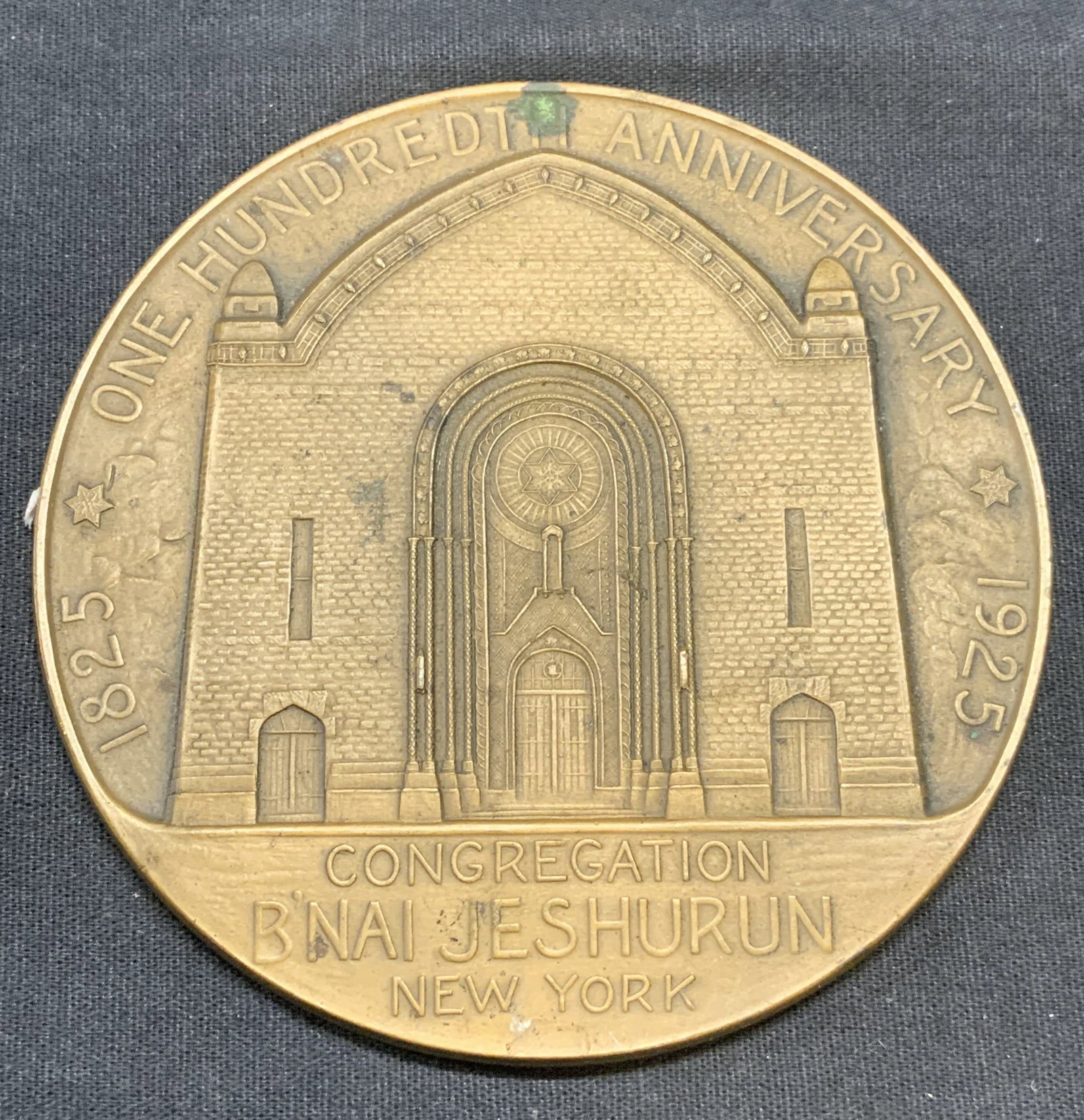 1925 BNai Jeshurun Anniversary Bronze Medallion: Bronze 1925 BNai Jeshurun congregation 100 year anniversary medallion. Embossed raised synagogue motif. Piece has weight. Measures approx. 4 inches diameter. Marked Whitehead Hoag on edge. Some surfac