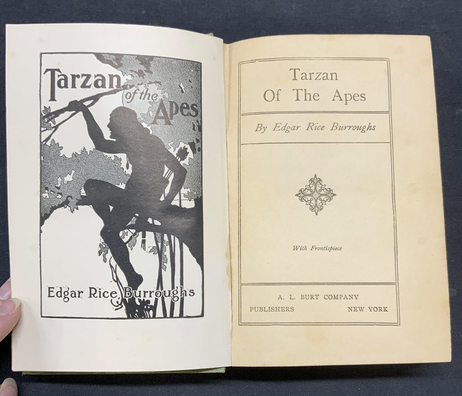 1914 1st Edt Tarzan of the Apes Edgar R Burroughs: Antiques hardcover copy of Tarzan of the Apes by Edgar Rice Burroughs. Published by A. L. Burt Company, 1914. First edition. Measures approx. 7.5 x 5.25 inches. Wear to cover, pages, and spine consist