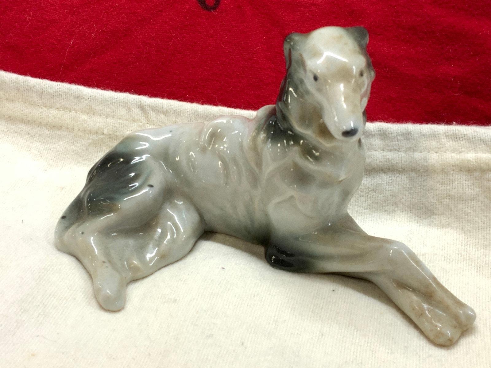 Mid Century Painted Porcelain Dog Figural, Japan: Hand Painted dog figural, stamped Made in Occupied Japan. Measures 5.5 in. Long x 3.25 in tall. Decorative arts, porcelain dog figurine, pair of porcelain dog figural, home decor and accessories, hand