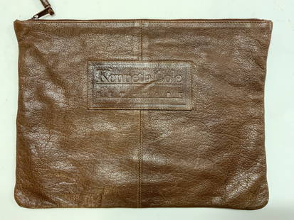 Kenneth Cole Leather Folder Sac with Wristlet: Brown textured leather folder/ paper sac with wristlet. Labeled Kenneth Cole New York on front side. Zipper closure. Lined with thick black cotton . Zippered interior side pocket. Clean inside