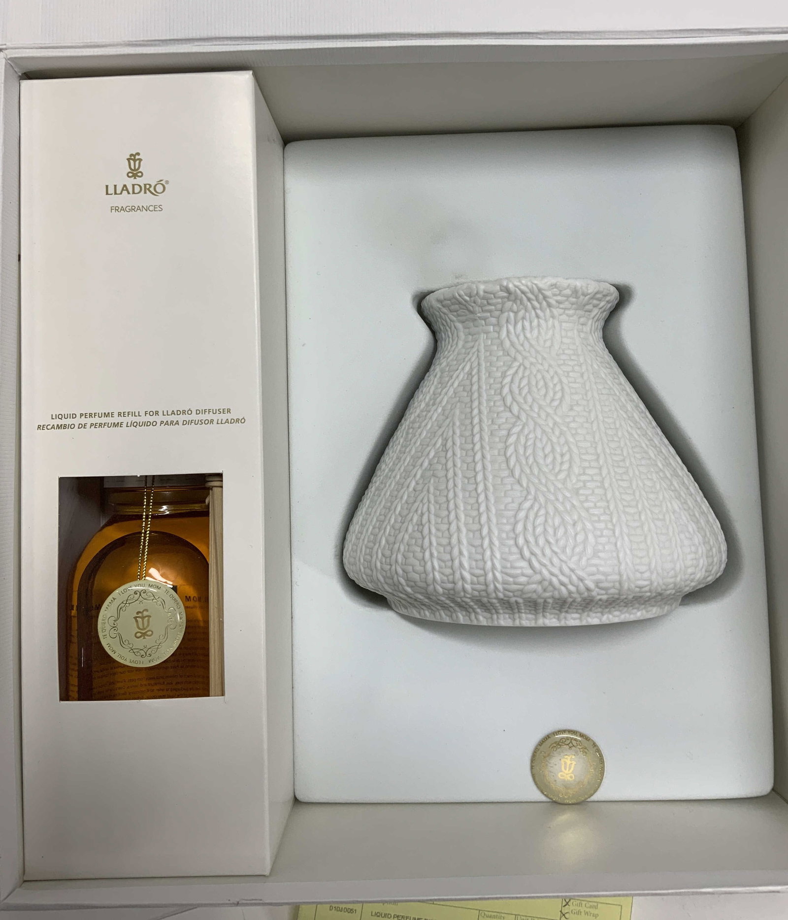 LLADRO BISQUE PORCELAIN DIFFUSER, NIB Spain: Lladro Fragrances white bisque porcelain vase , measures 5 in ht x 5.75 in wide. Comes with perfume fragrance and diffuser sticks., Packages in the original box. Never used. Original receipt included.