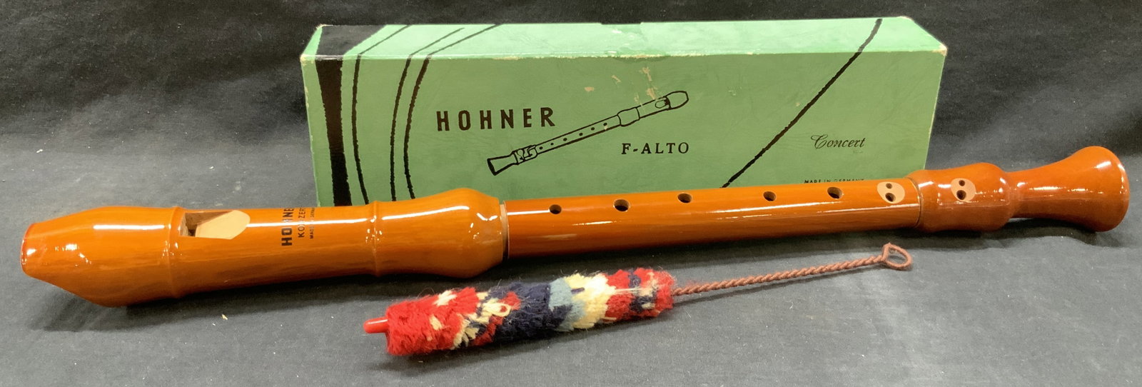 Hohner F Alto Wooden Recorder, Germany: Hohner f alto wooden made recorder, marked on box Germany. Wooden recorder with orange tone finishing, possibly never used. Comes with original green box with cleaning tool. Recorder is approx 19 inch