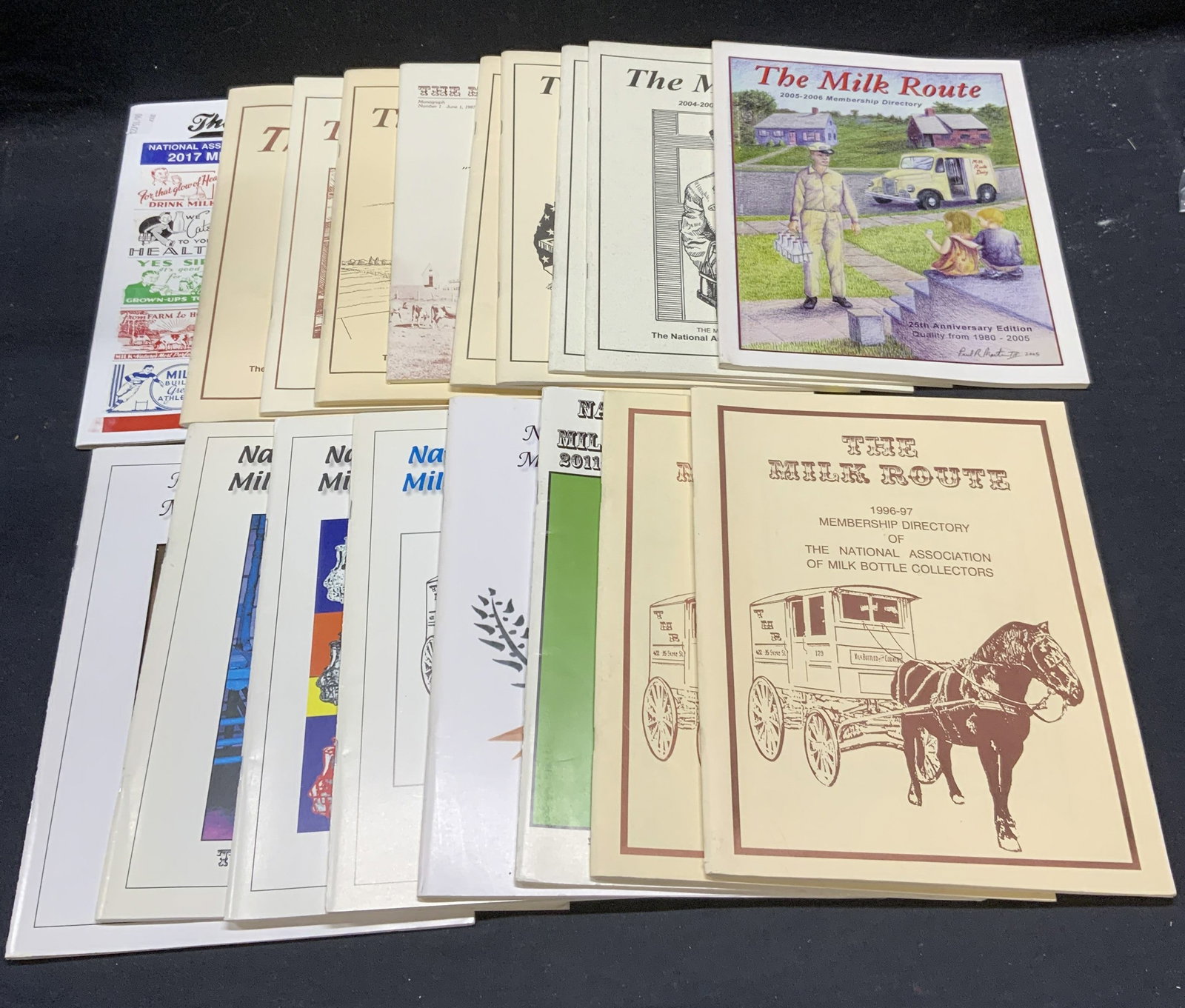 Group Lot Dairy Milk Bottle Collectors Directories: Group lot of 18 milk bottle collectors ephemera. Includes The Milk Route, National Association of Milk Bottle Collectors membership directories. Contains directory and dairy advertisements. Largest me