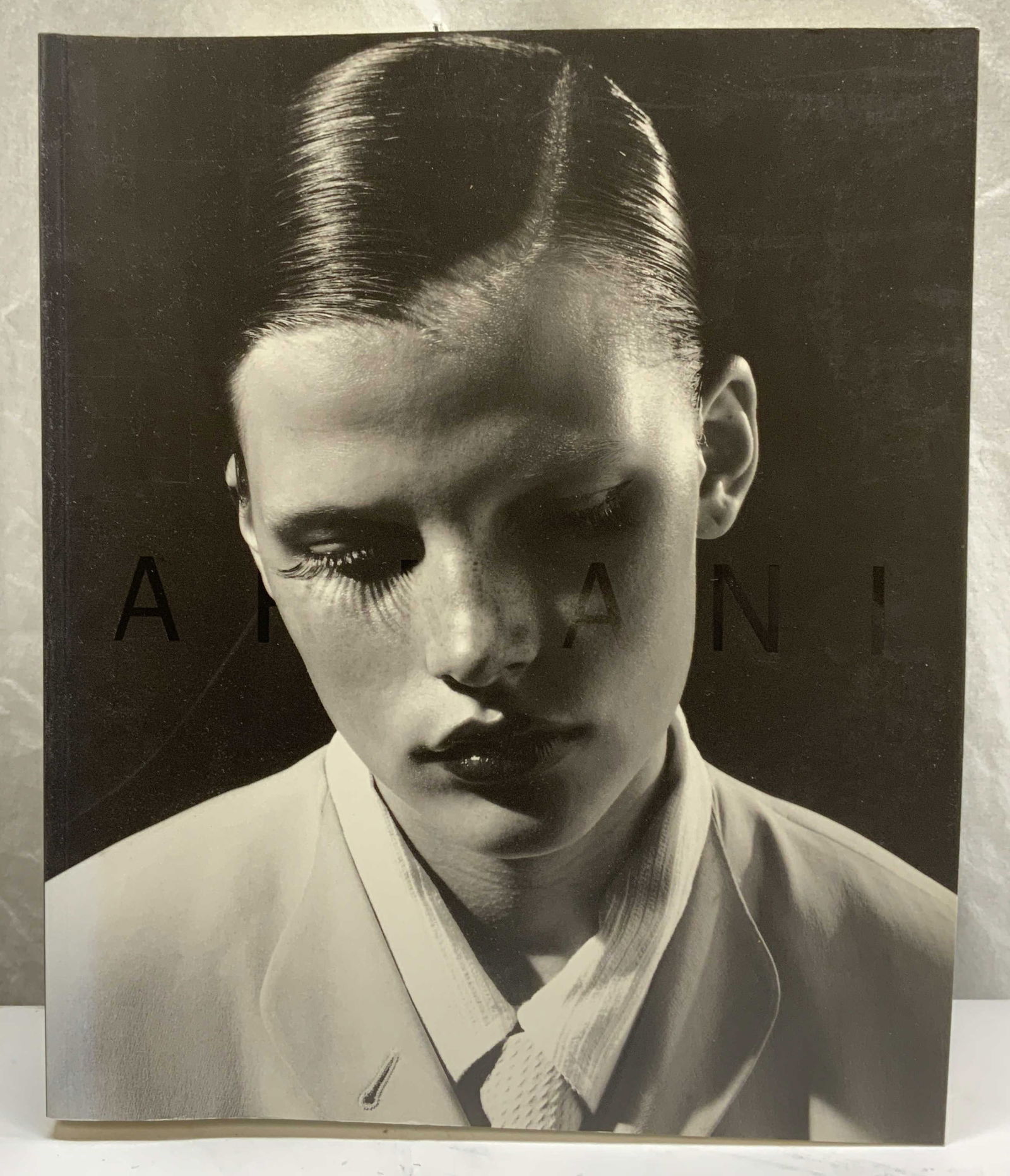 Giorgio Armani Fashion Book, Illustrated: Softcover copy of Giorgio Armani. Fashion exhibition book with photography and essays. Published by Solomon R Guggenheim Museum, no date. Measures approx. 12 x 10 inches. Some wear to cover, pages, an