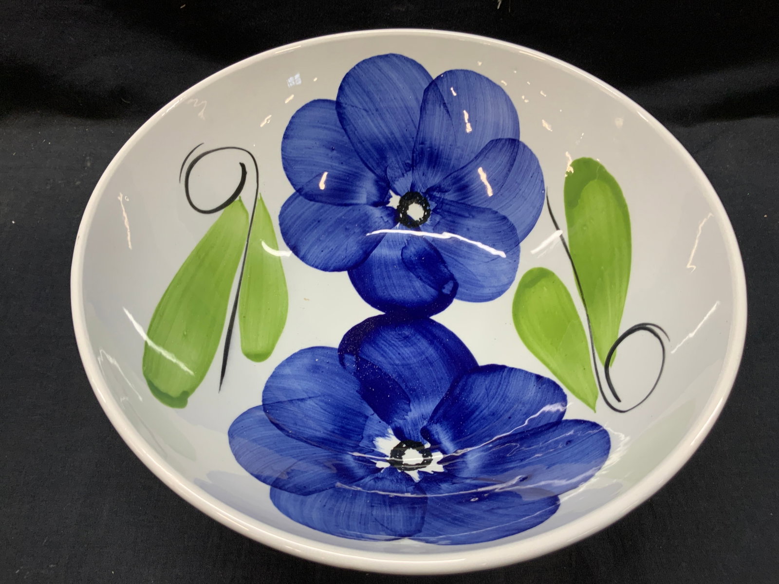 Ceramica S.Girgio Hand Painted Ceramic Bowl, Italy: White ceramic made bowl, with hand painted motifs of blue flowers, marked on underside Ceramica S.Girgio Made in Italy Approx 5 inches tall 12 inch diameter. Minor wearing to ceramic edges. Ceramic bo