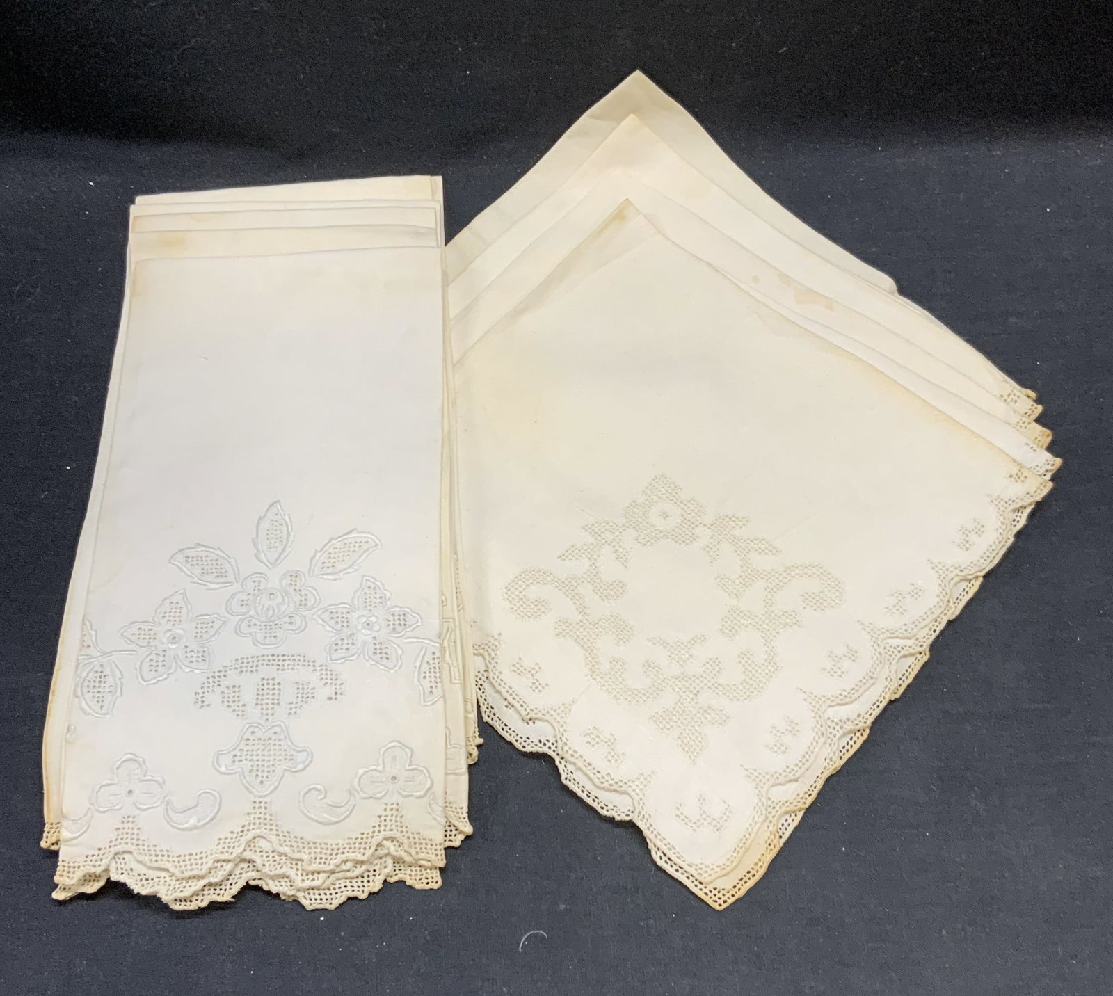 Lot 10 Vintage White Cotton Napkins: Lot 10 vintage white cotton napkins. Set of 4 with lace detail edges. Set of 6 with embroidered floral lace motif. Larger set measure approx. 21 x 14 inches. All pieces have some wear to material and 