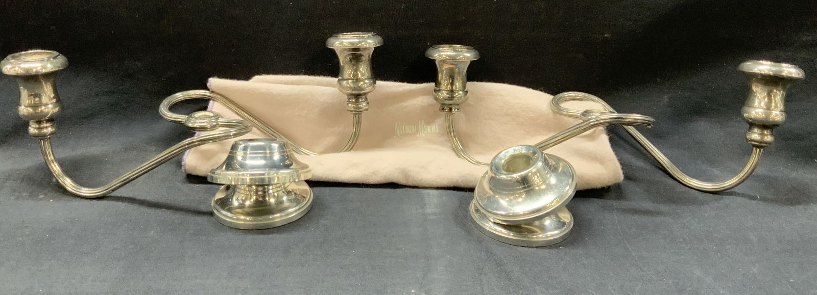 Pr Woodbury Pewter Candle Stick Arms +: Pair of pewter made candelabra arms with candle sticks on ends, comes with two pairs of candle sticks caps each. Marked Woodbury pewter. Approx 5 inches tall and 12 inches long. Comes with Neiman Marc