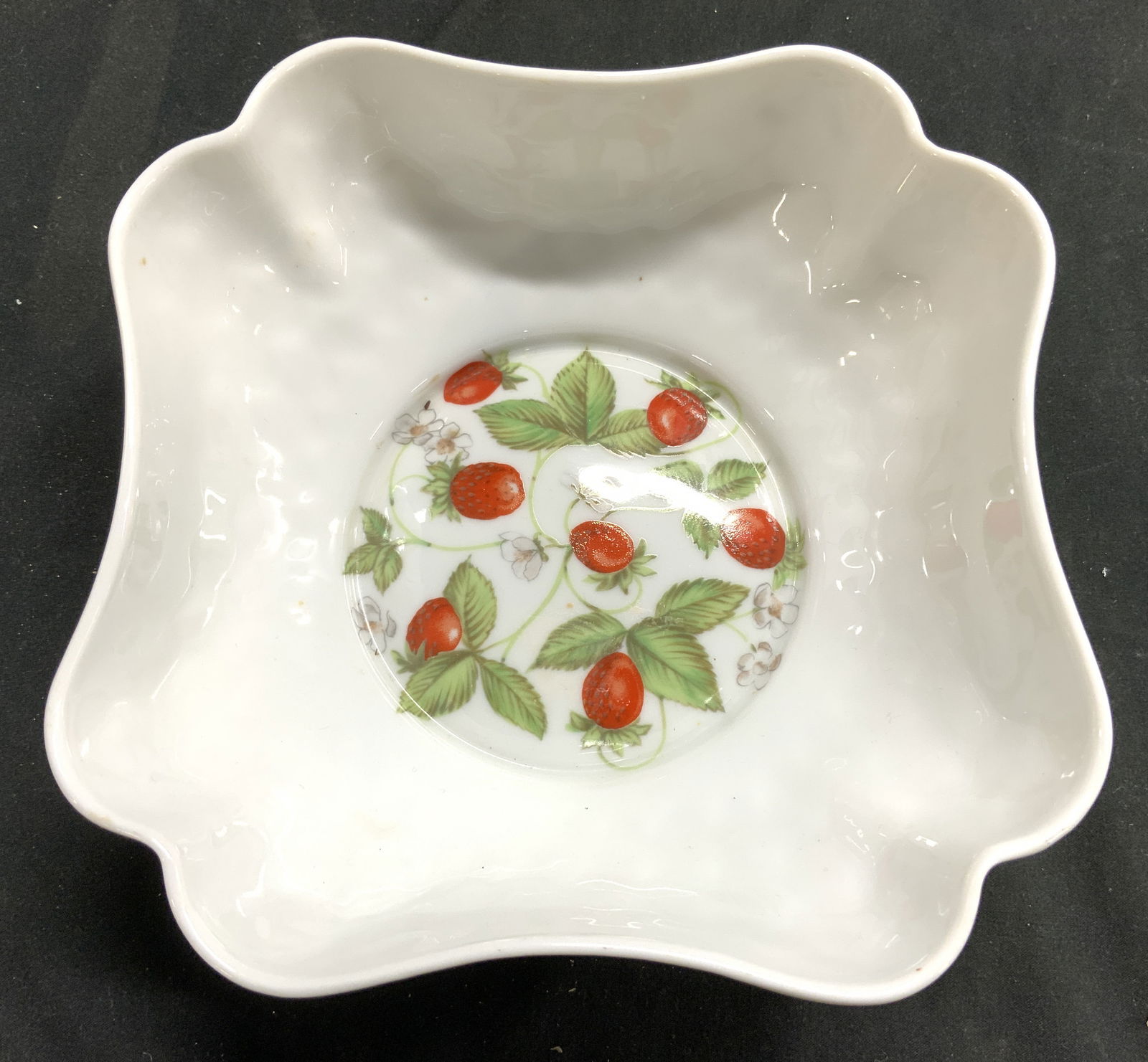 B & CO LIMOGES FRANCE Porcelain Bowl Vessel: Underside is marked B & CO LIMOGES FRANCE L BERNARDAUD & CO. Bowl is white toned and porcelain with strawberry and leaf detail. Exterior texture resembles scales. Piece measures approximately 6.5 inch