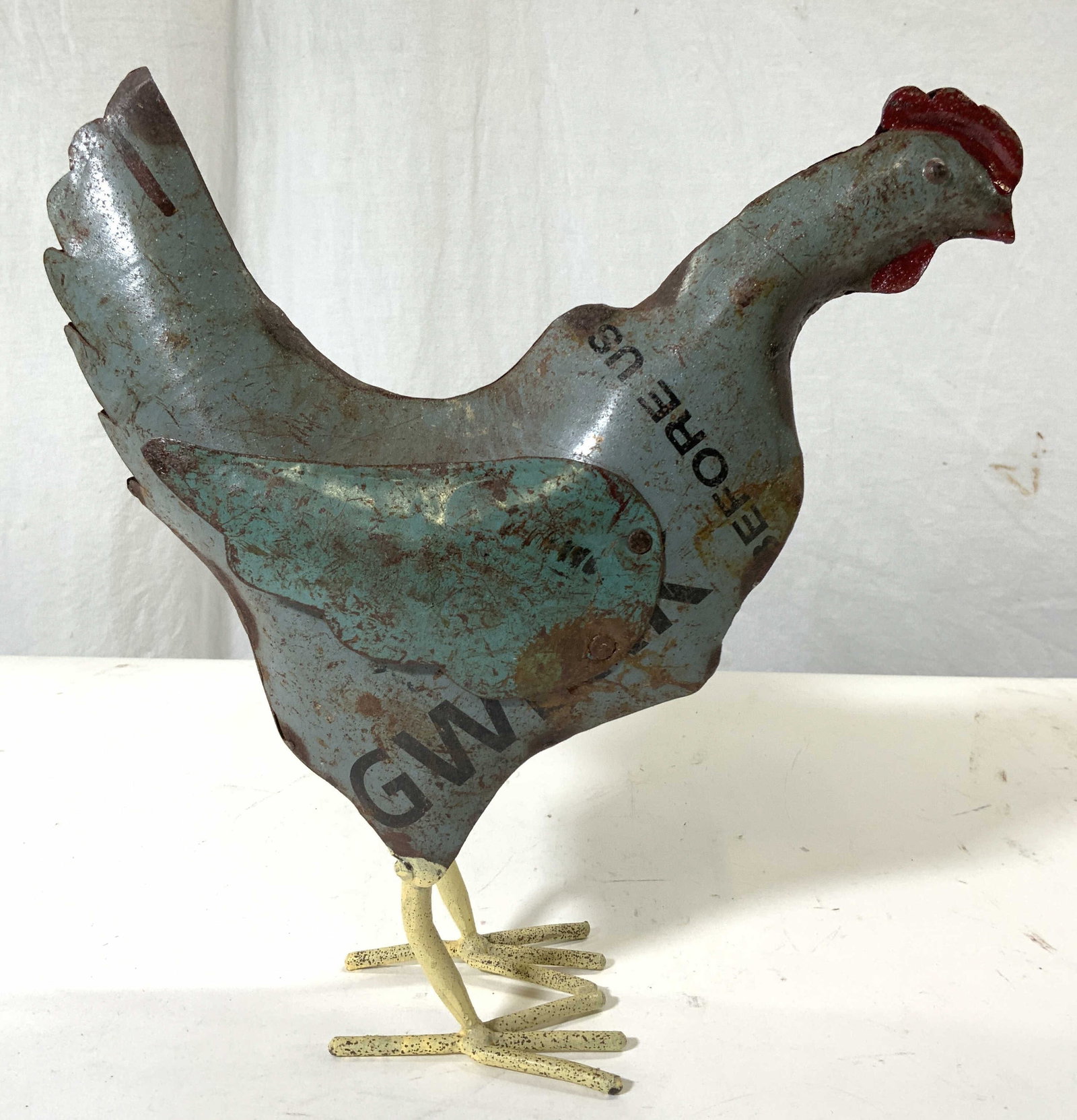 Hand Crafted Metalwork Rooster Sculpture: Rooster sculpture is metal. Piece appears to be hand crafted. Appears to be made from upcycled metal signs. Piece measures approximately 10.5 inches tall & deep 3.5 inches wide. Rooster sculpture, met