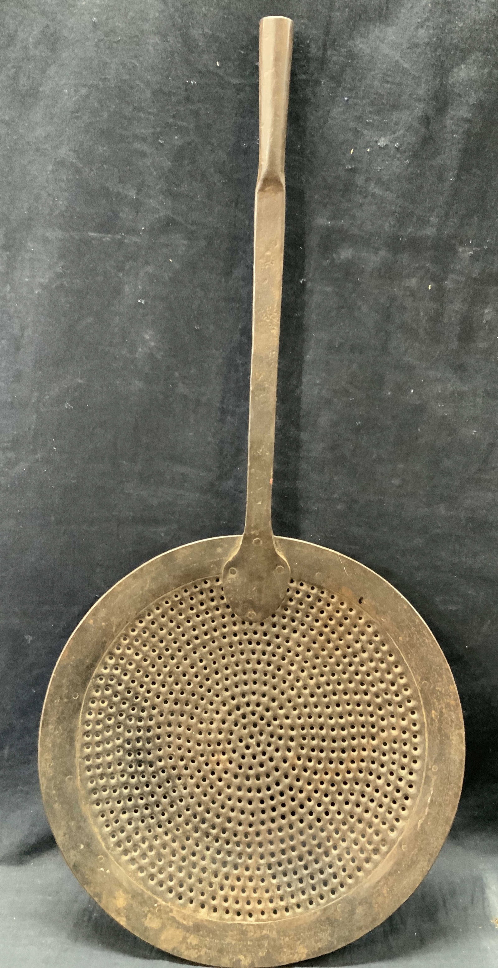 Vtg Hand Crafted Iron Frying Spoon: Hand crafted iron made vintage frying spoon with large granulated spoon cup with long handle. Approx 27 inches long and spoon being 13 inch diameter, Evident wearing to metal due to age and use. Vinta