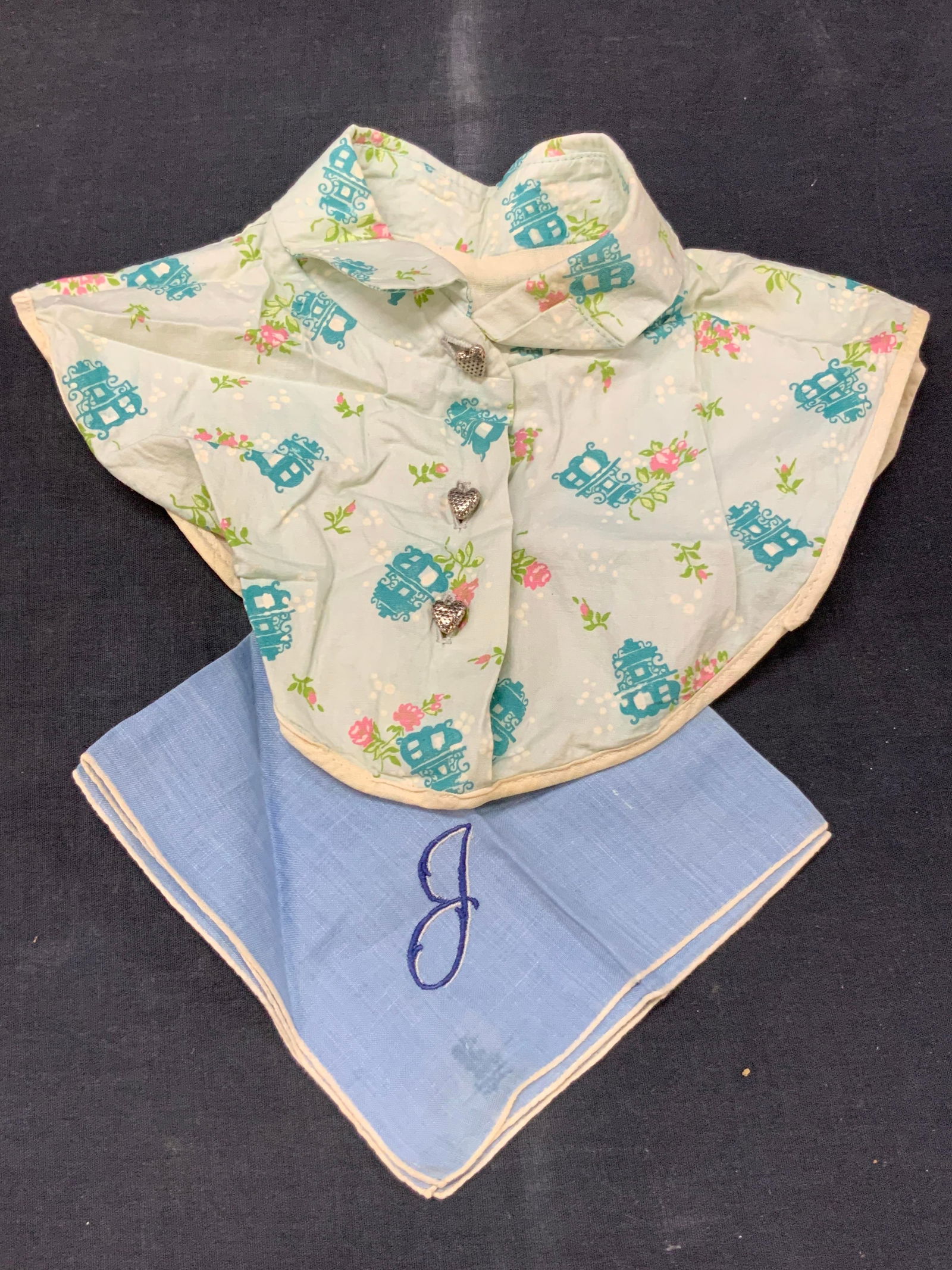 Vtg Baby Clothes & Cotton Handkerchief: Lot of 2 vintage accessories. 1 blue toner handkerchief with blue embroidered Initial on corner. Approx 11 x 11 inches and 1 cotton made shawl for a baby or doll with floral motifs and heart buttons,