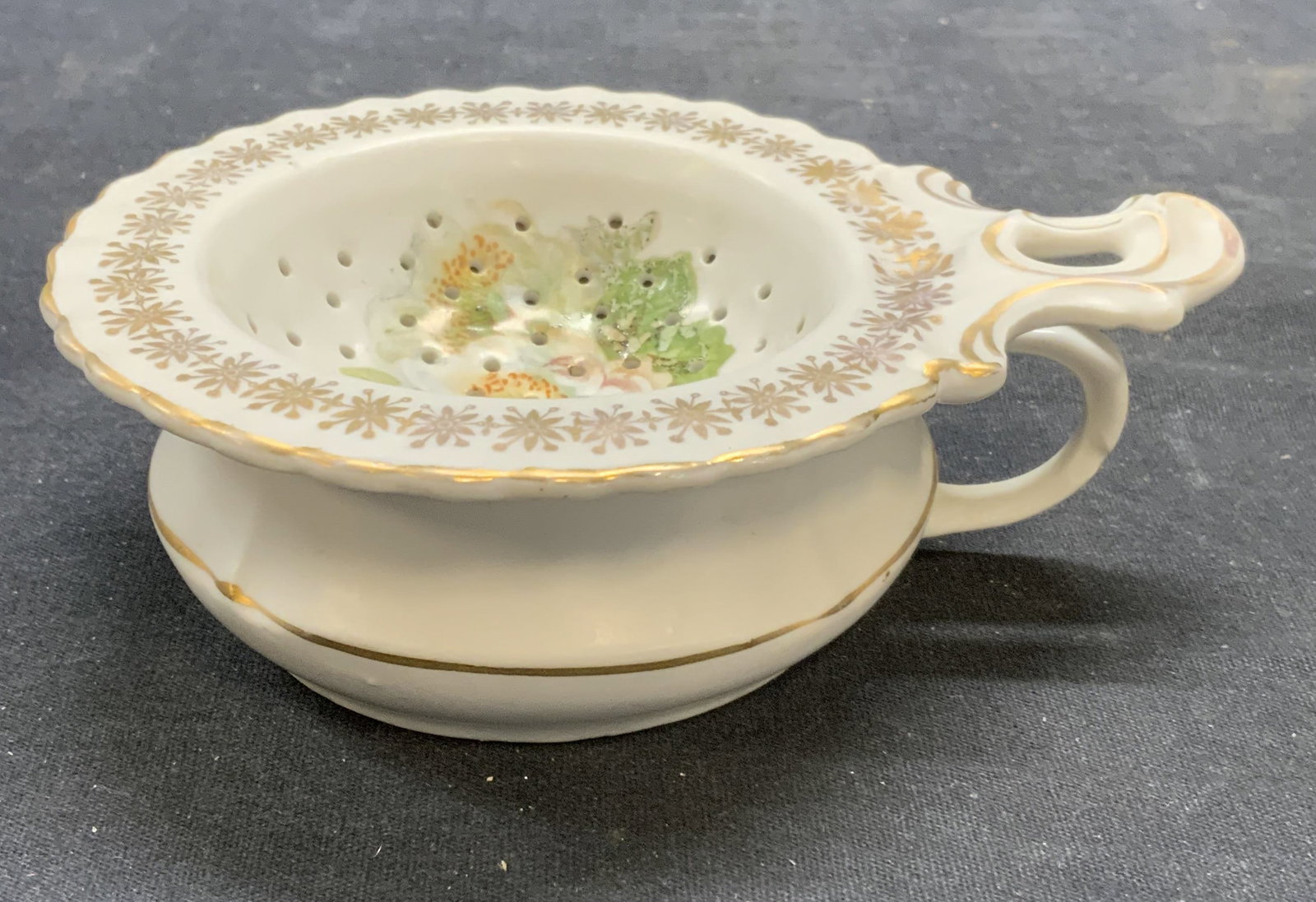 Vtg MMV Co Porcelain Teabag Rest Cup Germany: Vintage MMV Co porcelain teabag rest with cup. Hand painted floral motif with gilt decoration. Trademarked to underside. Made in Germany. Rest measures approx. 5 x 4 x 1 inches. Cup measures approx. 3
