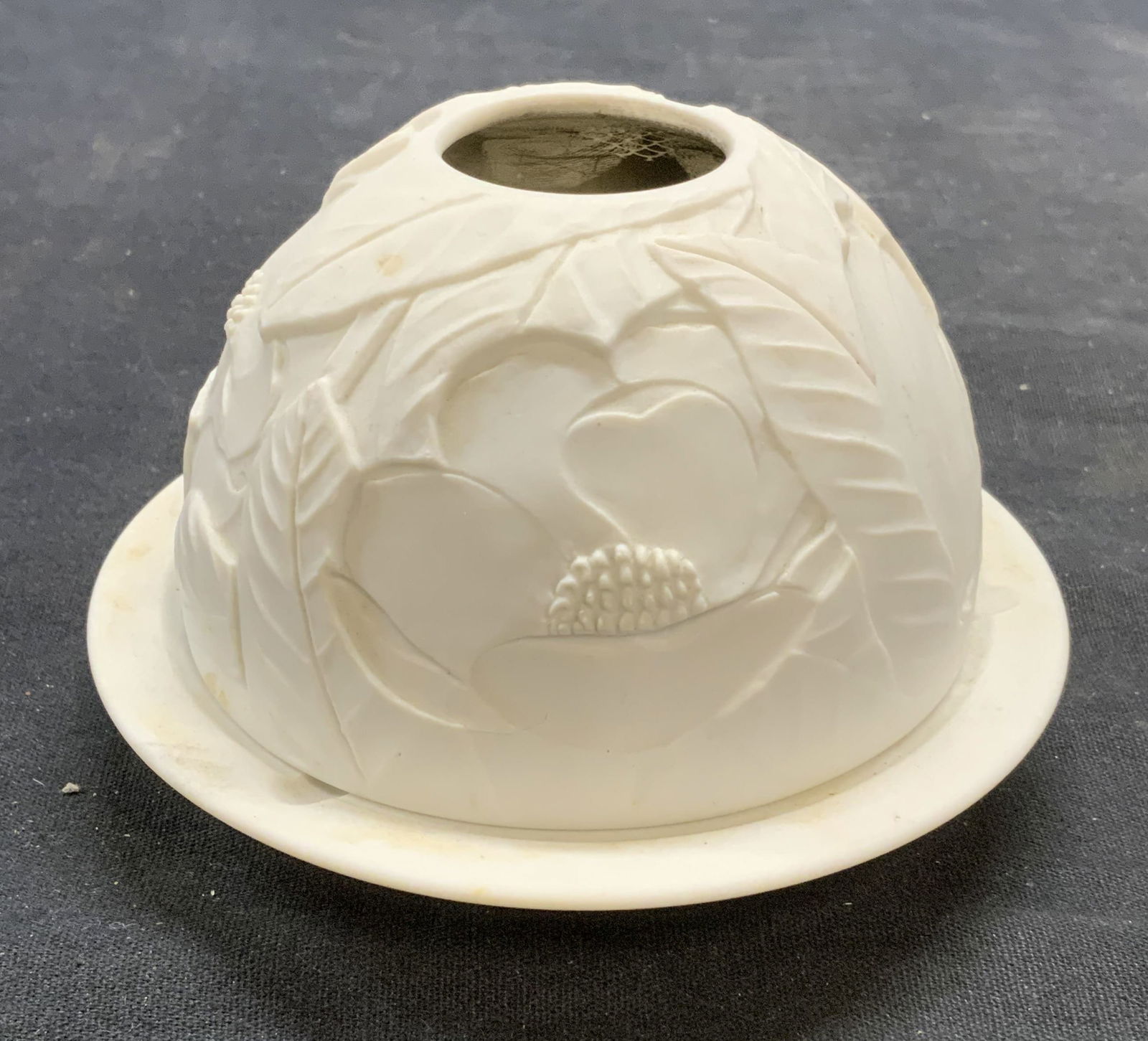 BERNARDAUD Porcelain Candleholder & Cover: BERNARDAUD white porcelain candleholder with cover. Raised floral motif on cover. Trademarked to underside. Made in France. Measures approx. 4.5 x 3.25 inches. Some surface wear including scratching a