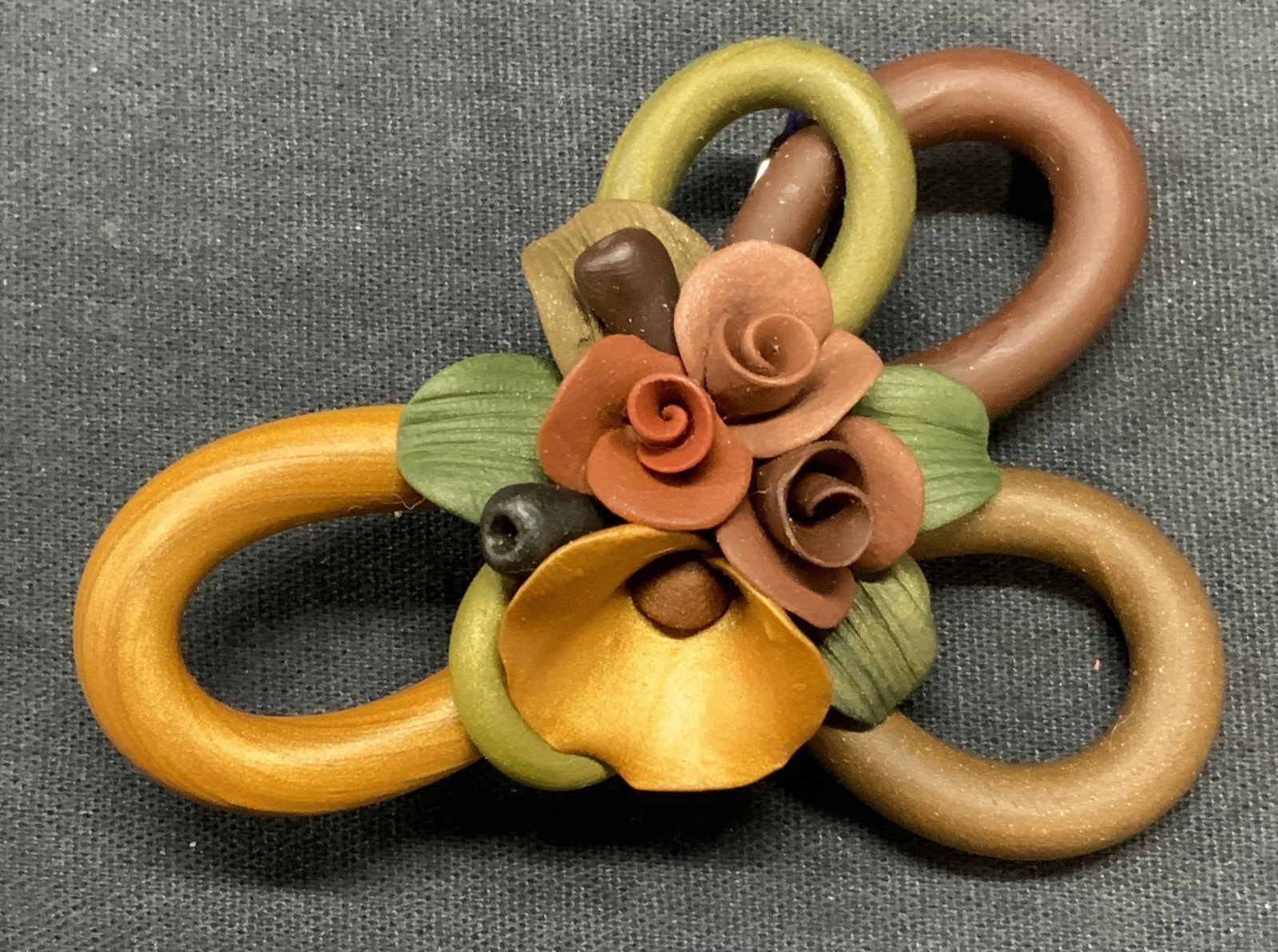 Handmade Clay Flower Brooch, 3 Inches: Handmade clay flower brooch. Hinge pin to underside. Measures approx. 3 x 2 inches. Some surface wear including scratching observed. Estate jewelry, costume jewelry, cocktail jewelry, fashion jewelry,