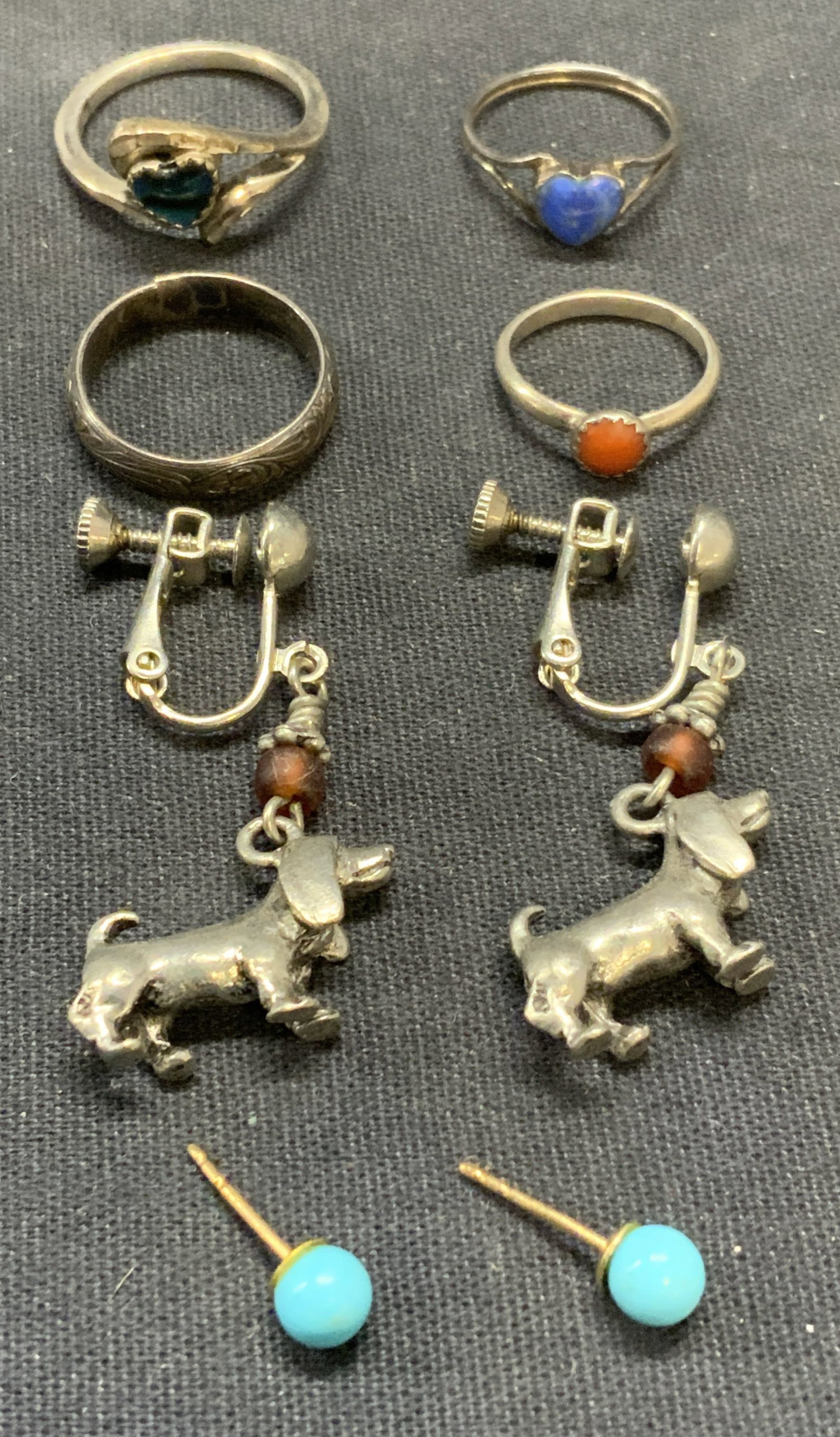 Lot 6 Sterling Silver Rings & Dog Earrings More: Lot of 6 jewelry pieces. 4 vintage sterling silver rings with enamel and stone decoration. All pieces test for sterling using PuriTEST kit. Smallest ring size 1.5, largest 6. Total weight 6.6 grams. S