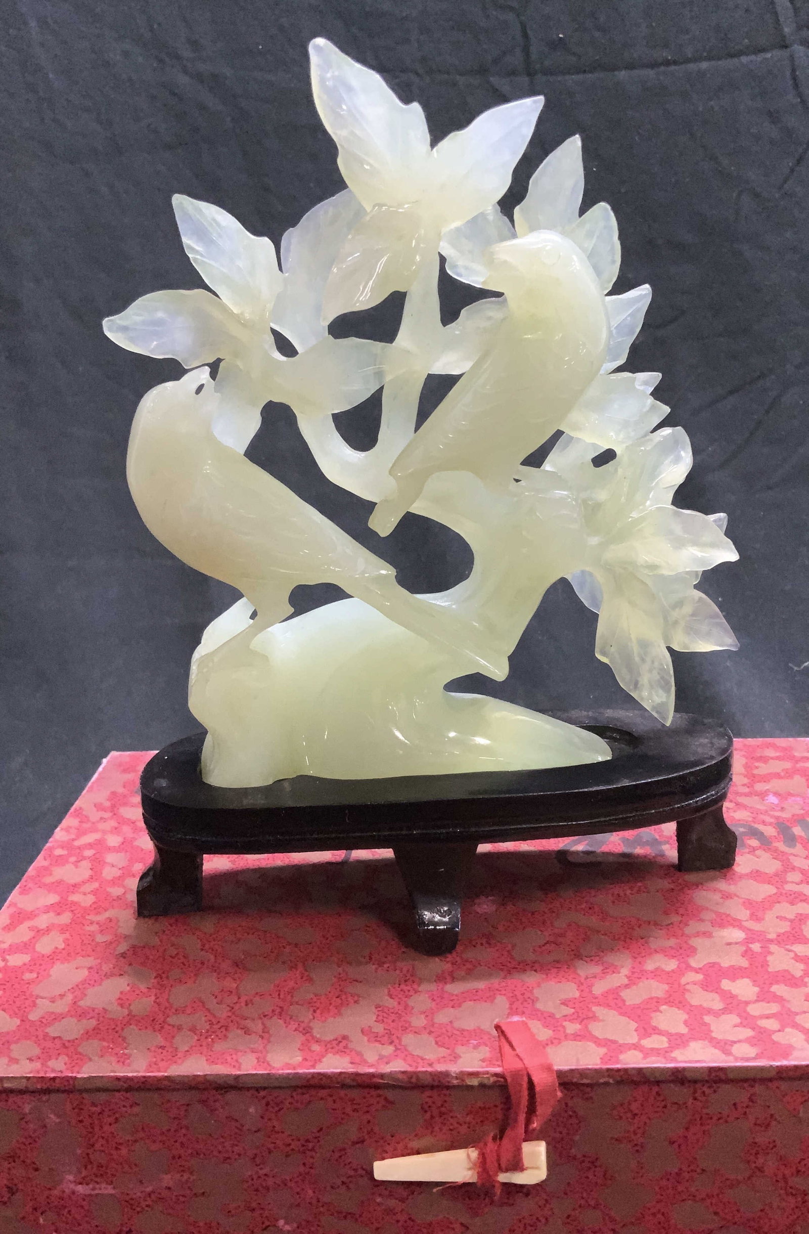Asian Carved Stone Bird Sculpture W Wood Base: Luxury hand craved and polished natural stone asian bird sculpture with an Asian wood base fitted for the sculpture. 1942 cttw. Possibly green Quartz. Sculpture comes in its original asian box , measu