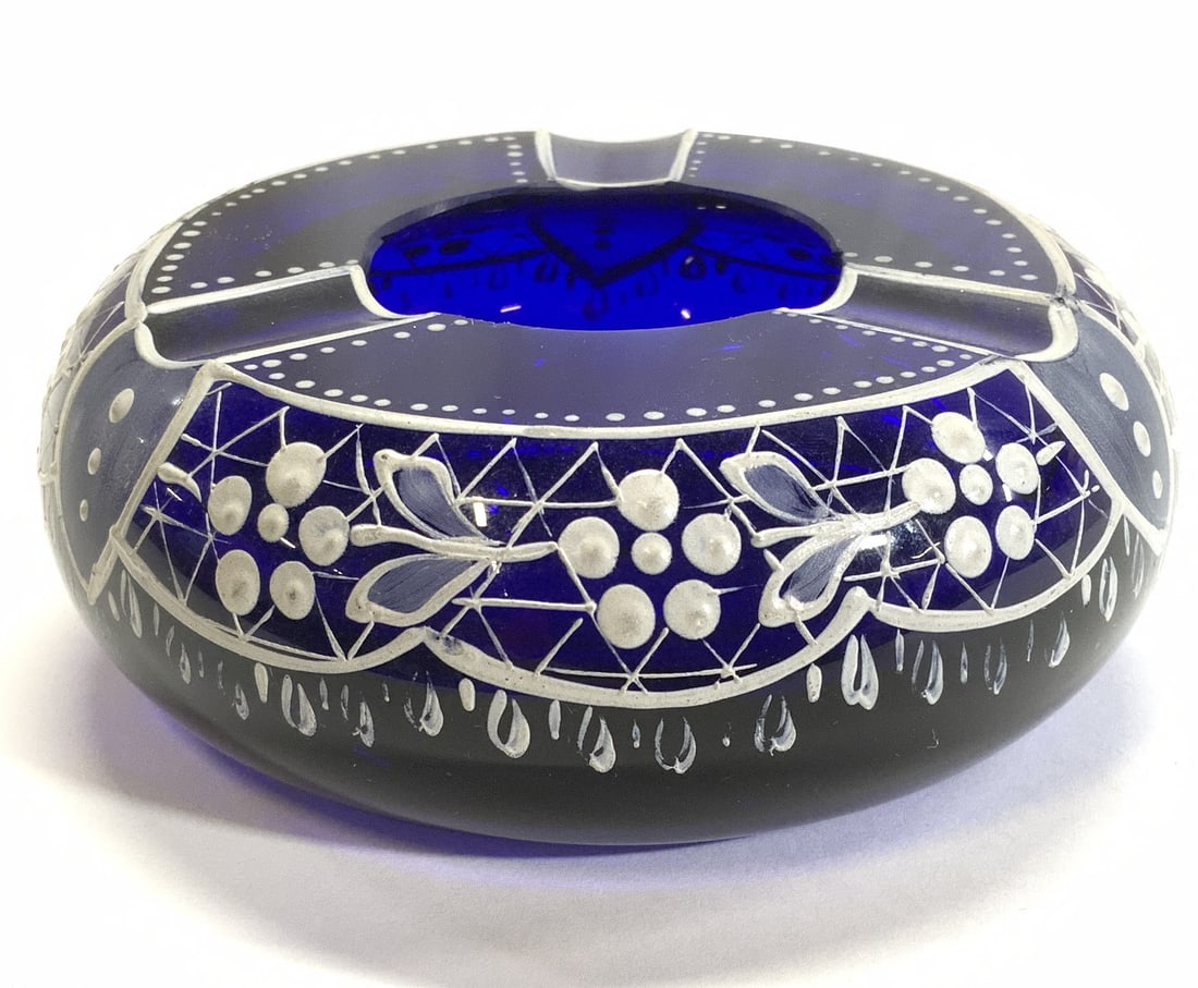 Hand Painted Cobalt Blue Glass Ashtray: Thick walled cobalt blue ashtray, hand painted in white. Measures 4 in. diameter, 1.75 in ht. Ashtray, hand painted cobalt blue glass ashtray, decorative arts, table top decor and accessories, home ac