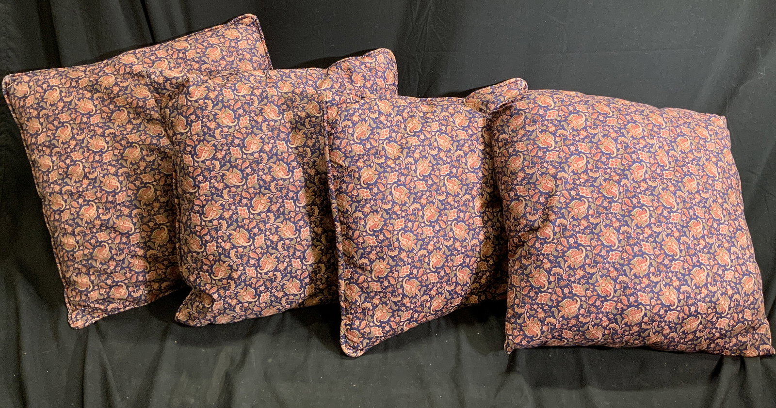 Set 4 Paisley Print Upholstered Pillows: Lot includes 4 pillows. Each have multi toned paisley printed upholstery. Three out of the four pillows have welted edges. Each pillow measures approximately 15 inches square. Pillows, set of pillows,