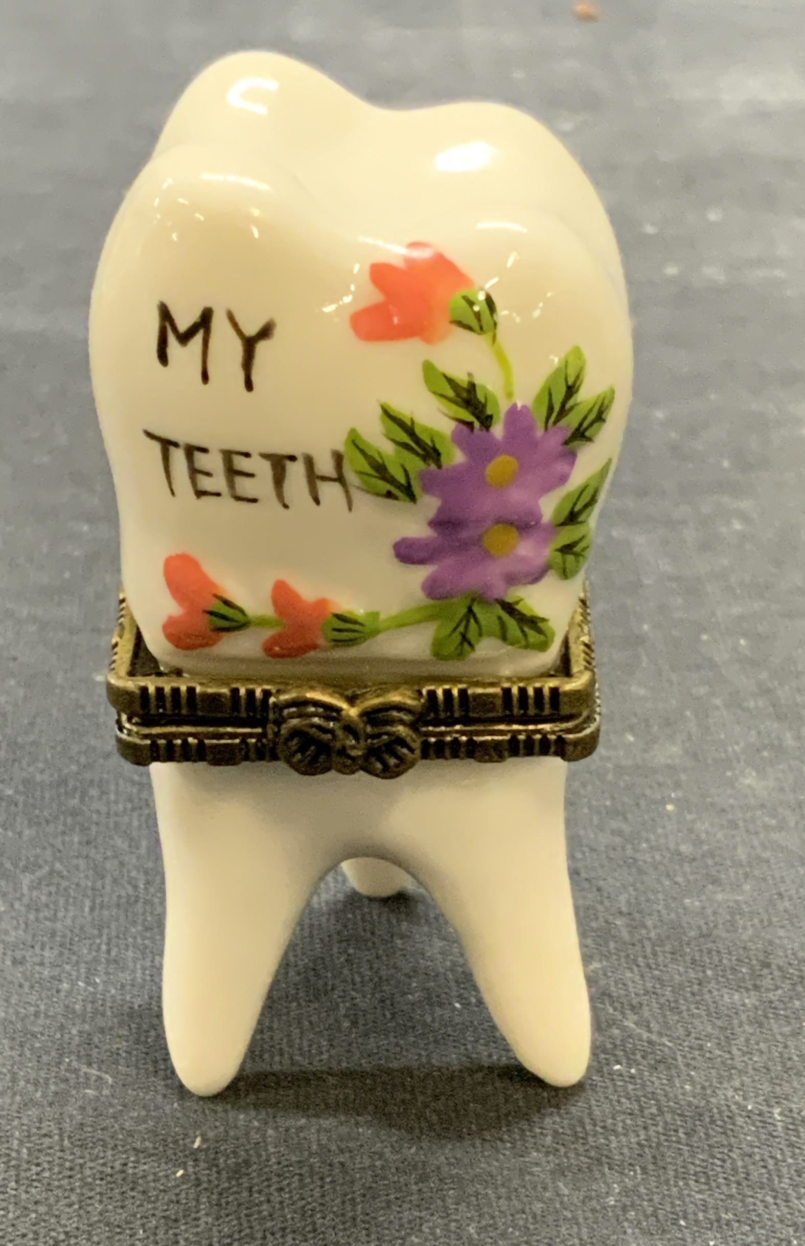 Vintage Porcelain Tooth Pill Box NIB: Vintage porcelain tooth trinket box with tooth trinket. Hand painted with box form latch. Box measures approx. 1.25 x 1.25 x 2.75 inches. Includes gift box. New in box. Tooth trinket box, trinket box,