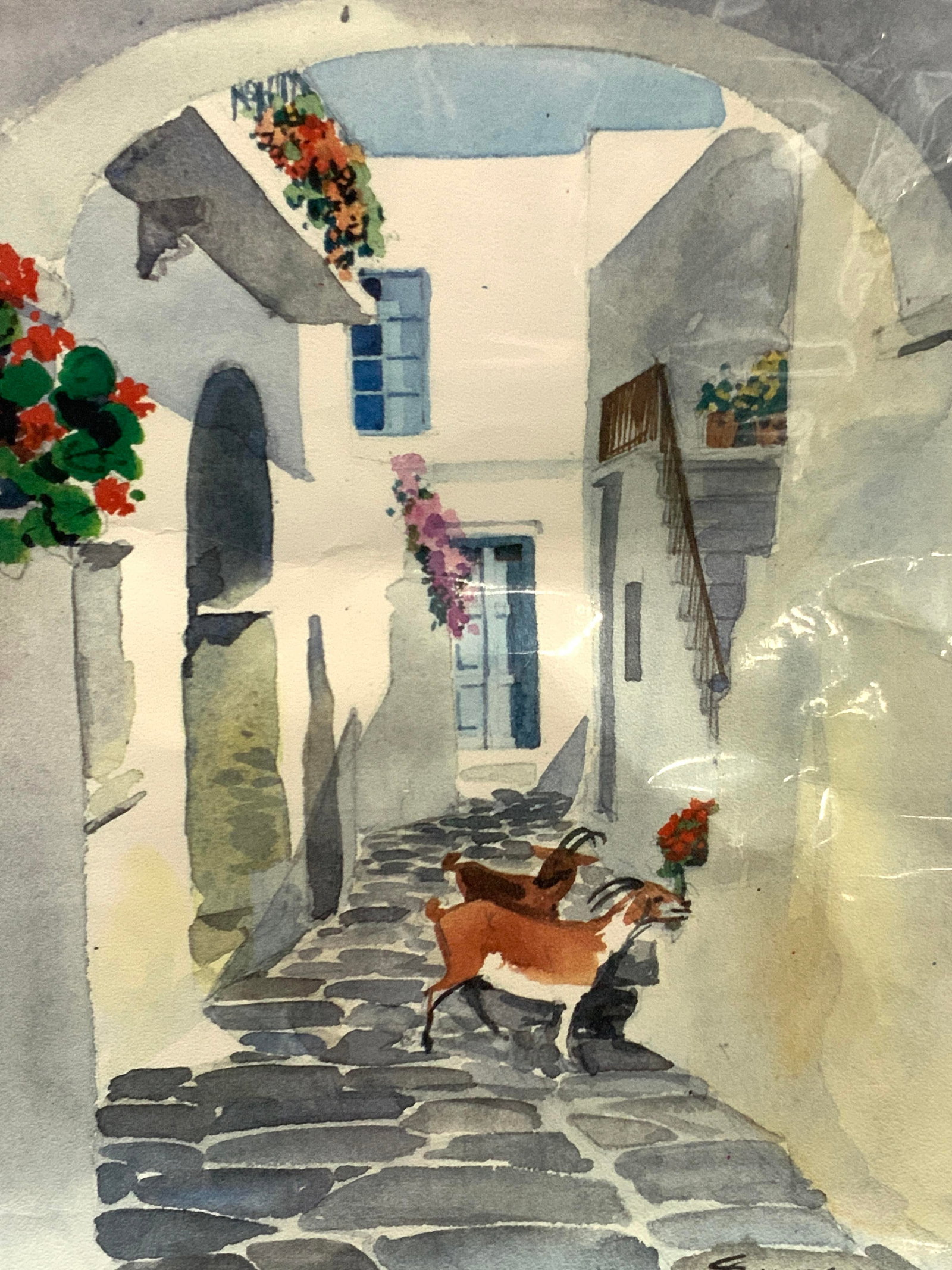 Simitis Archway W Goats Lithograph: Marked on corner Simitis Depicts an archway towards a white clay building with goats eating flowers on the pathway, No frame. Approx 13 x 10 inches Evident creasing to paper art due to storage. Home d